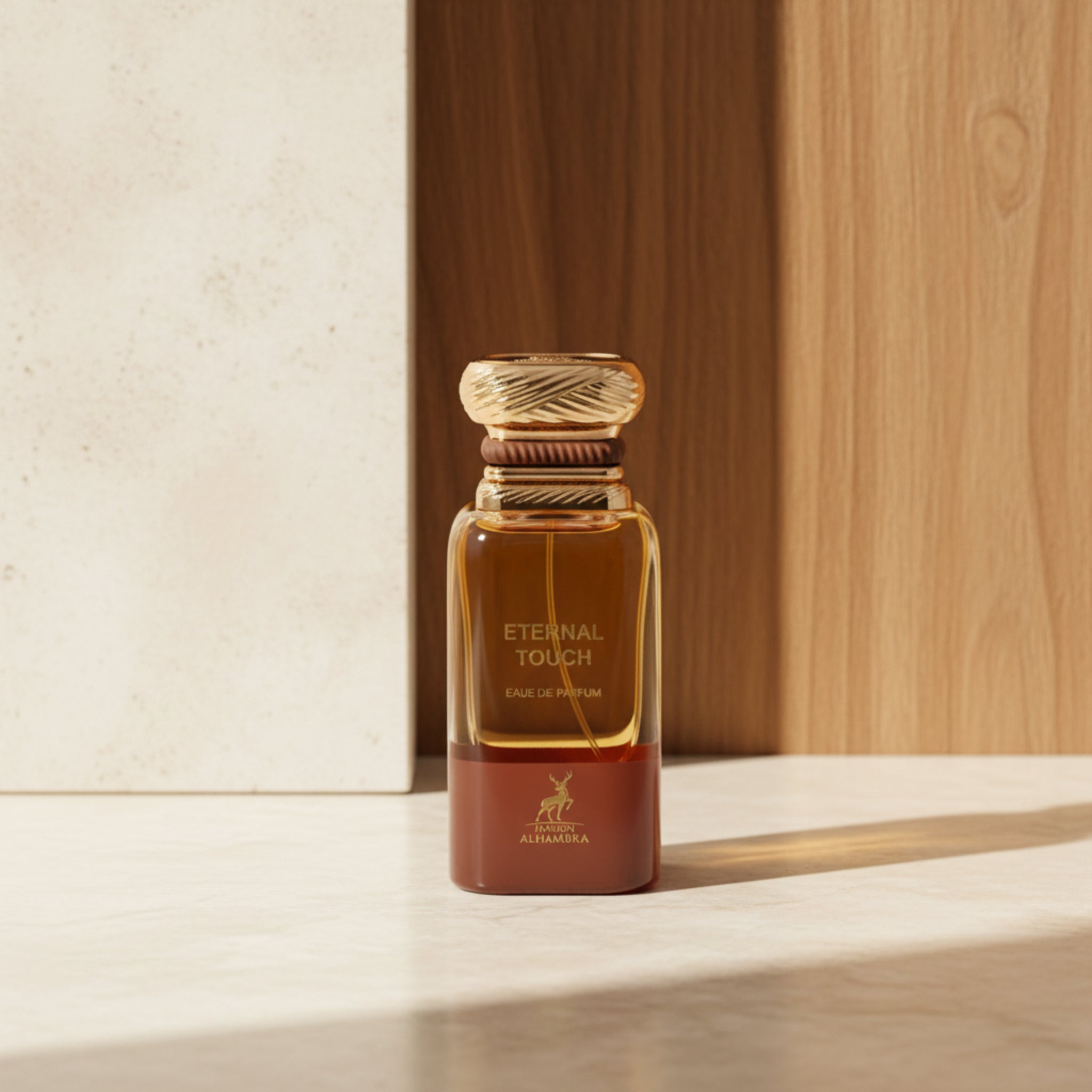 Perfume bottle labeled 'Eternal Touch' by Maison Alhama on a white background