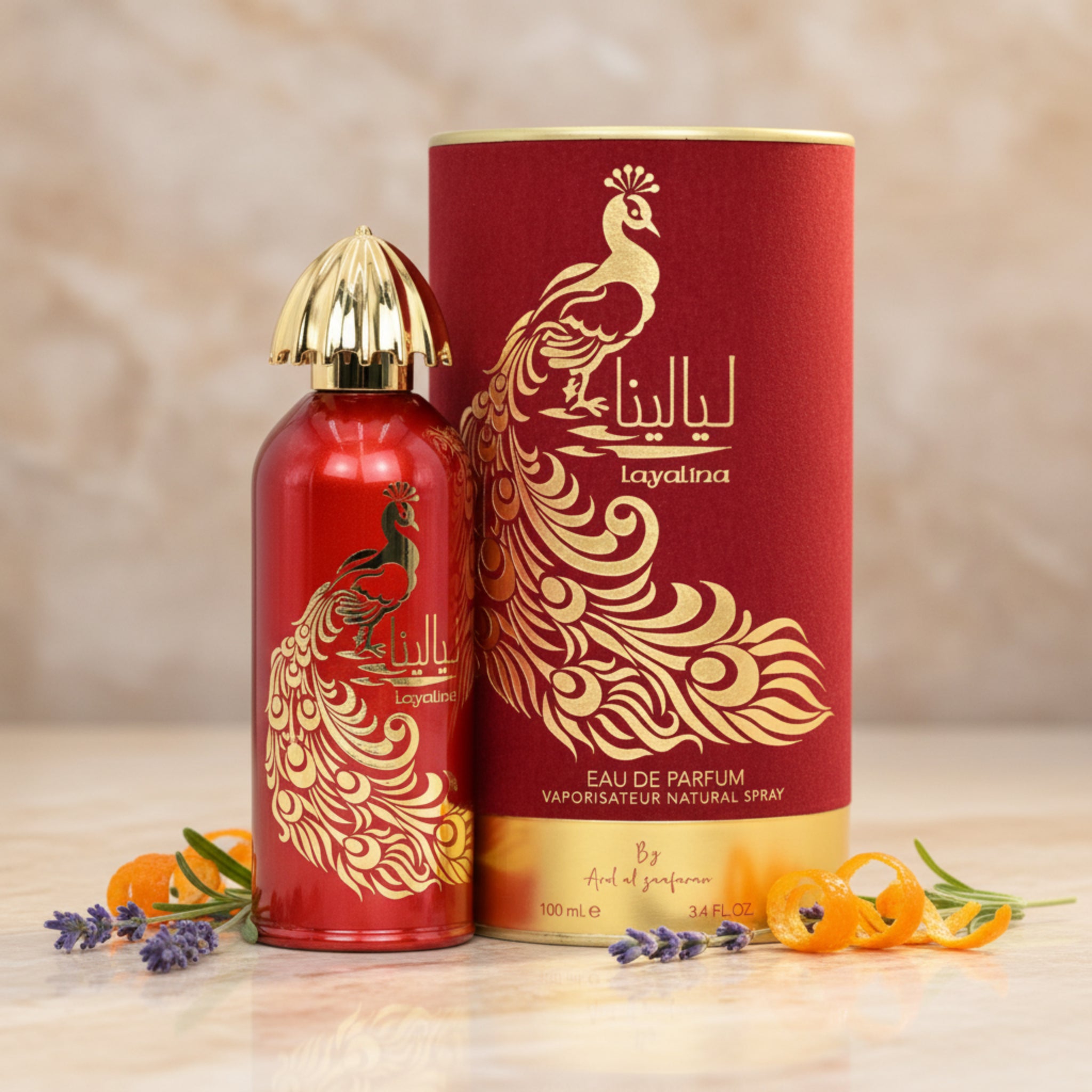 Red and gold Layalina perfume bottle and packaging on a white background