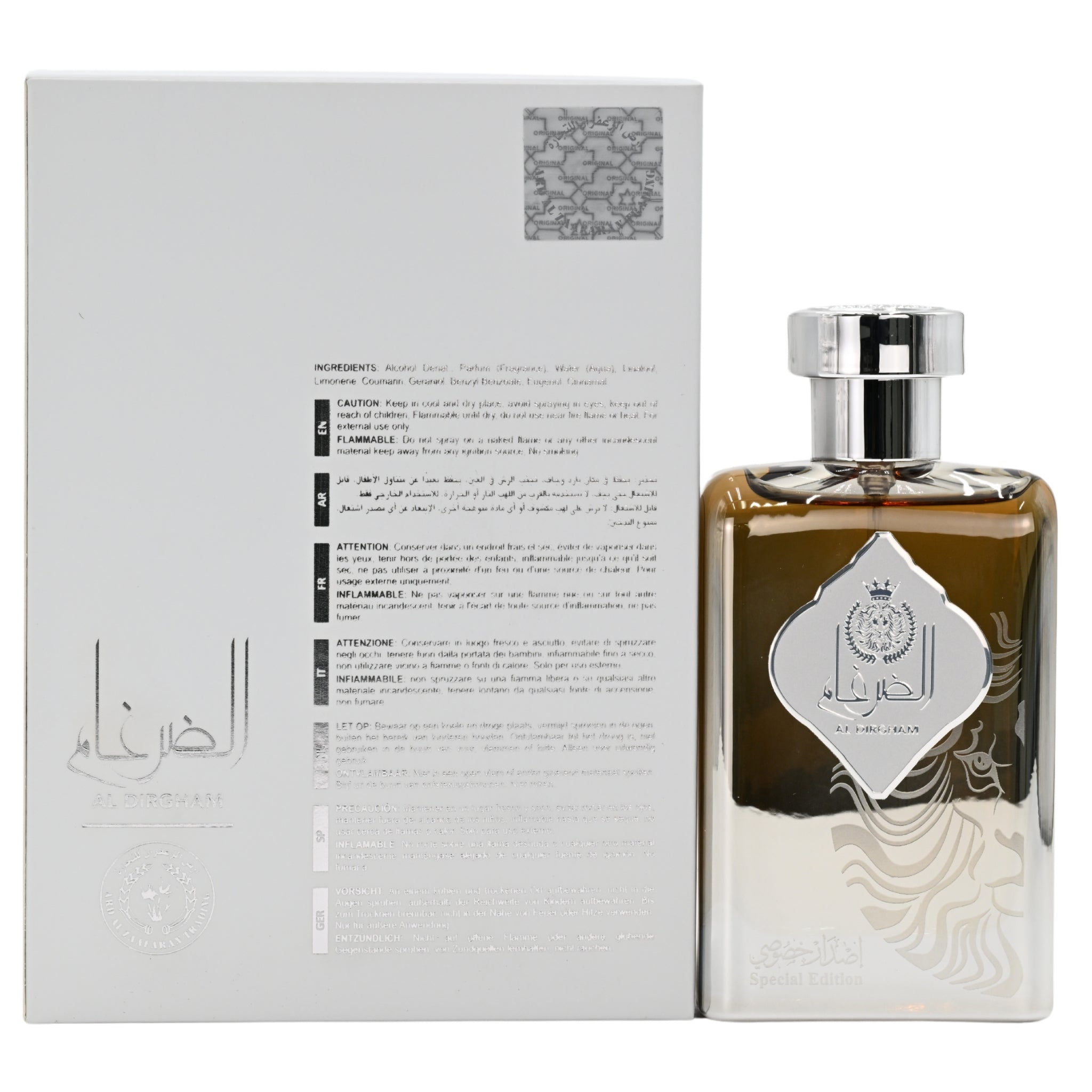 Perfume bottle with silver cap and decorative label next to its packaging on a white background