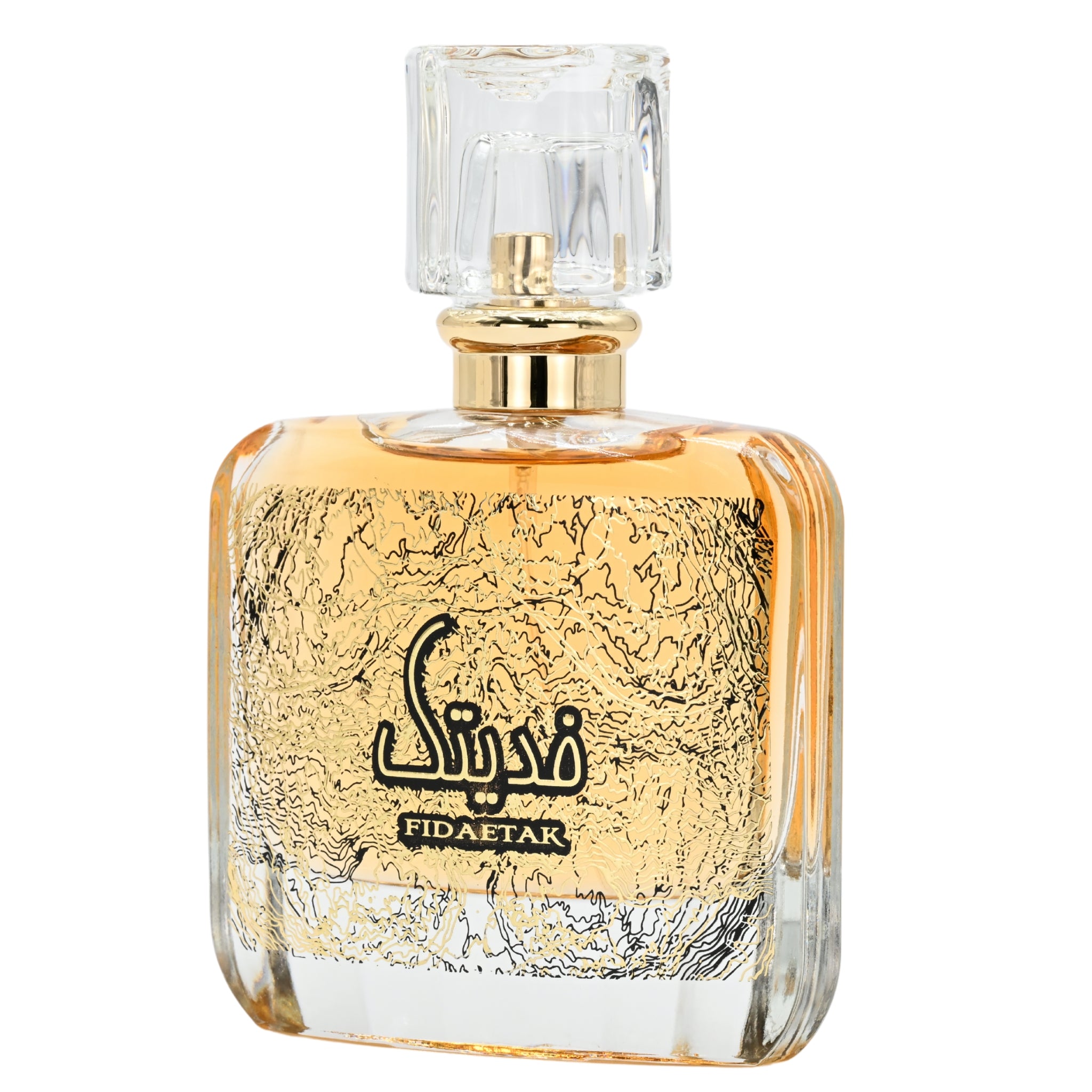 Perfume bottle with gold cap and textured glass body on a white background