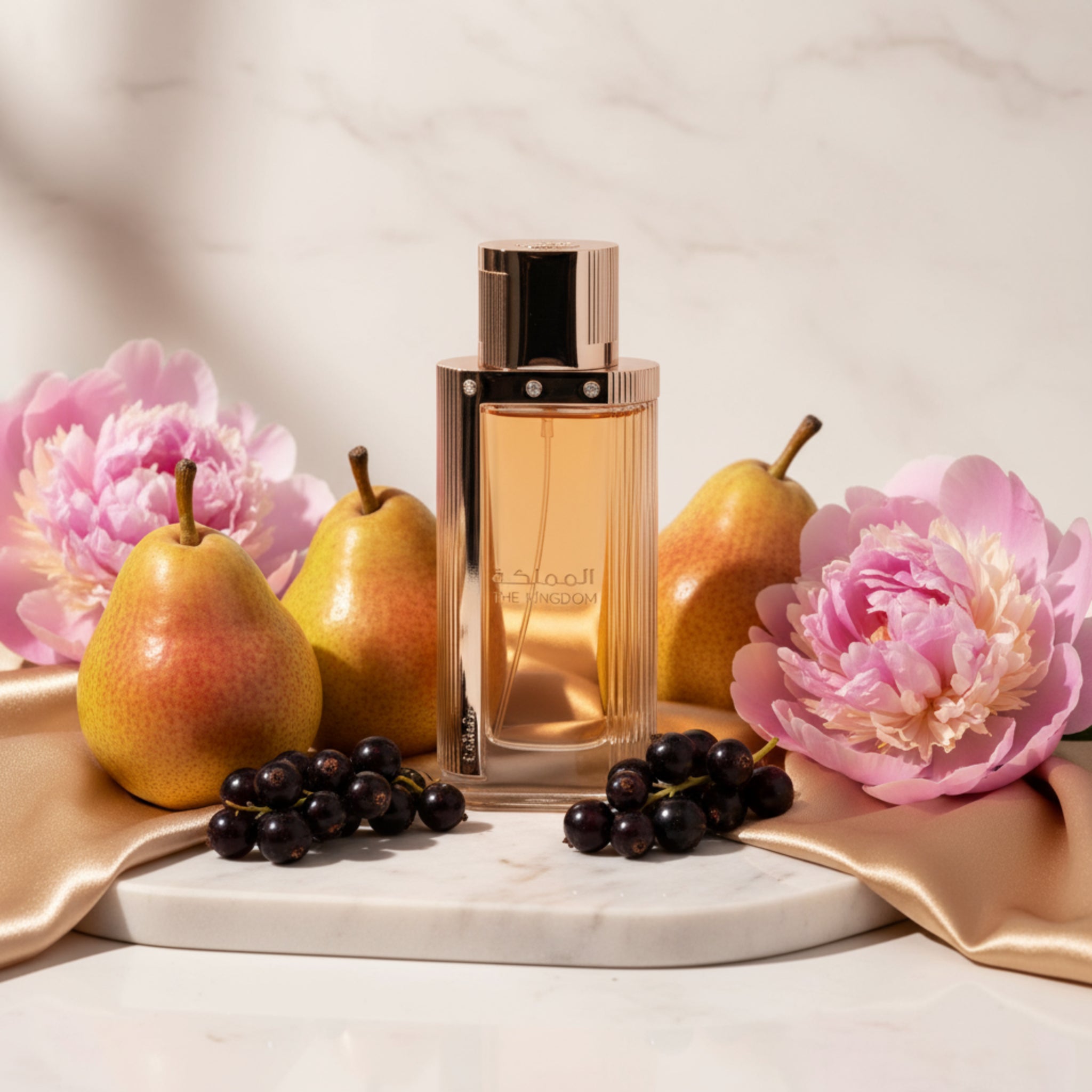 Perfume bottle with gold cap and clear body on a white background