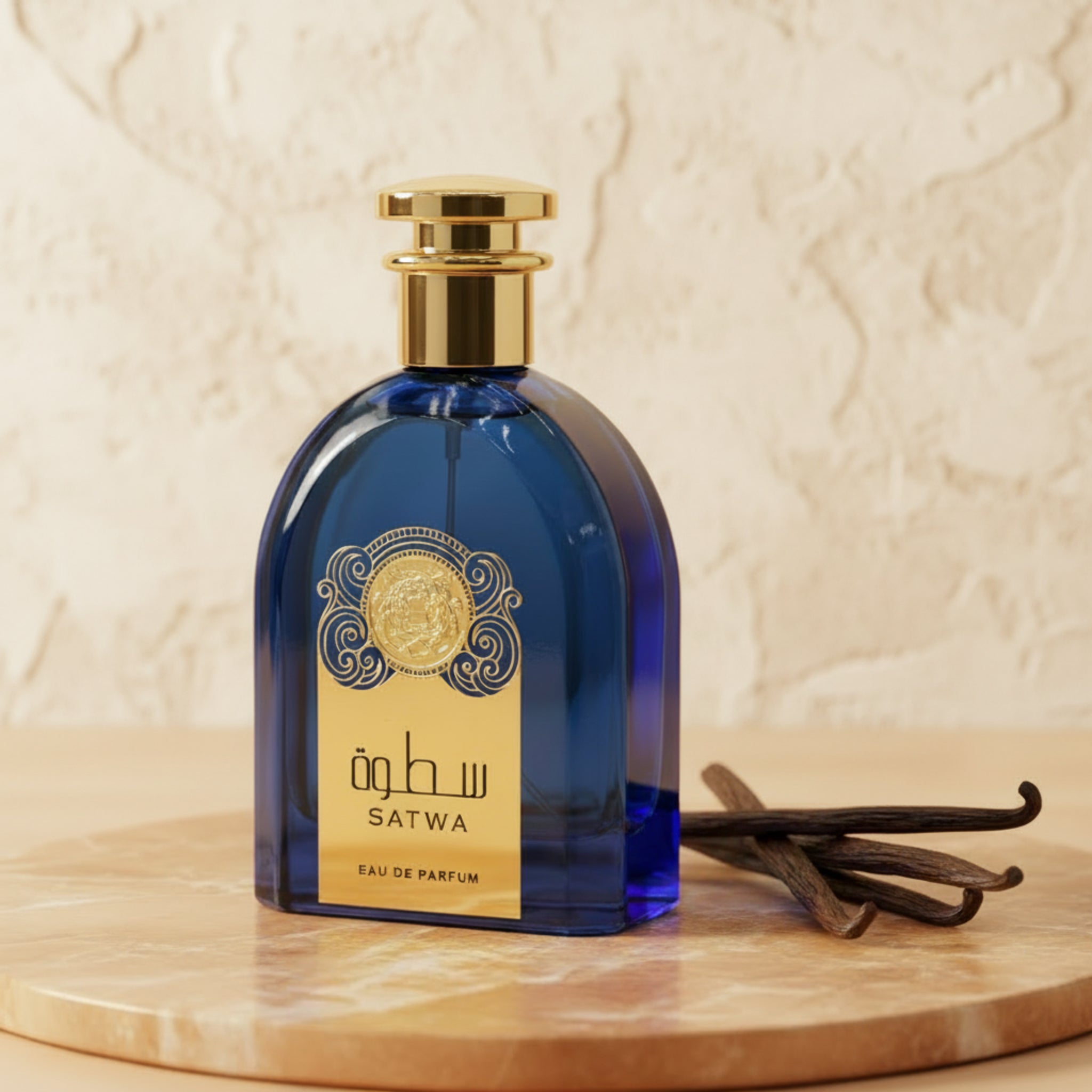 Blue perfume bottle with gold cap and label on a white background