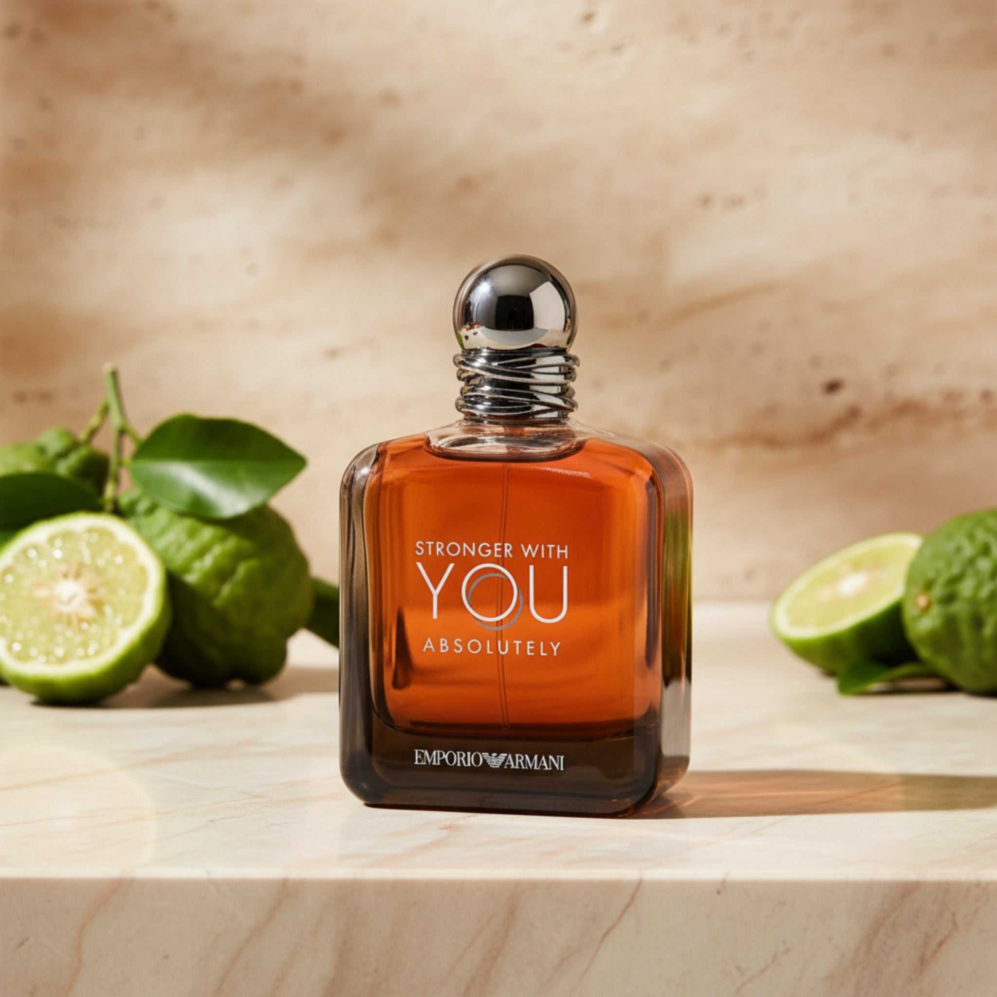 Perfume bottle with orange label and silver cap on a white background