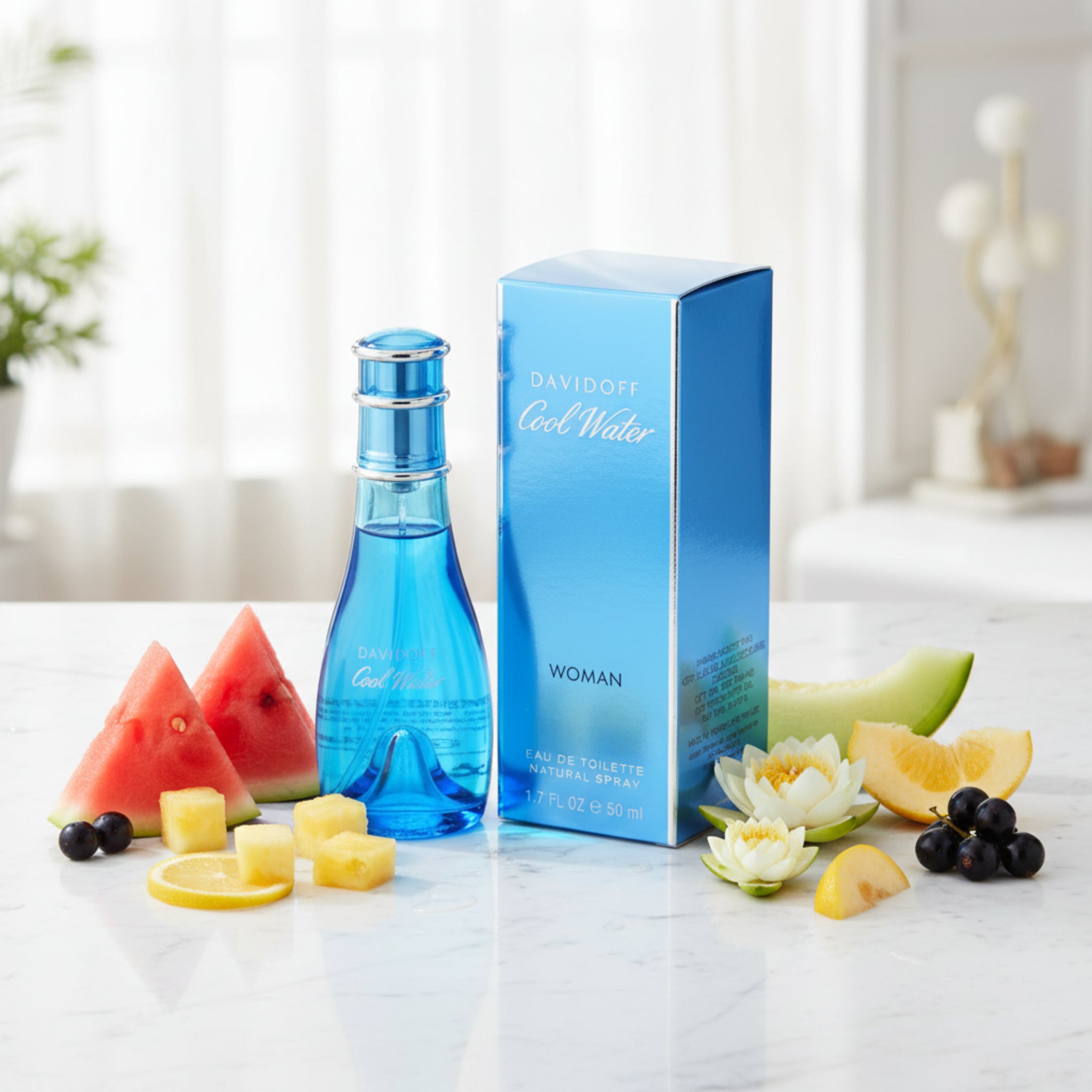 Blue perfume bottle and packaging with 'Davidoff Cool Water' branding on a white background