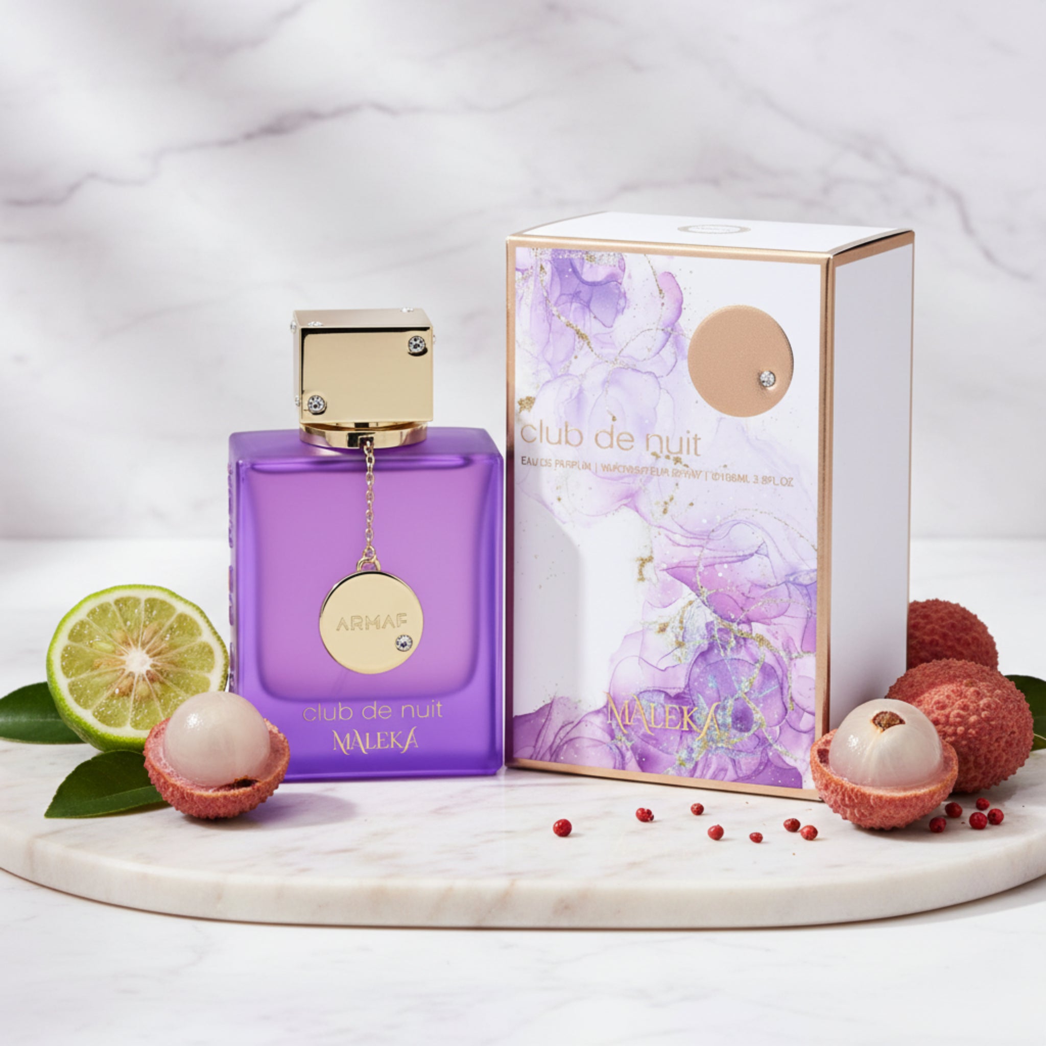 Purple perfume bottle with gold cap and 'Maleka' branding next to its packaging on a white background.