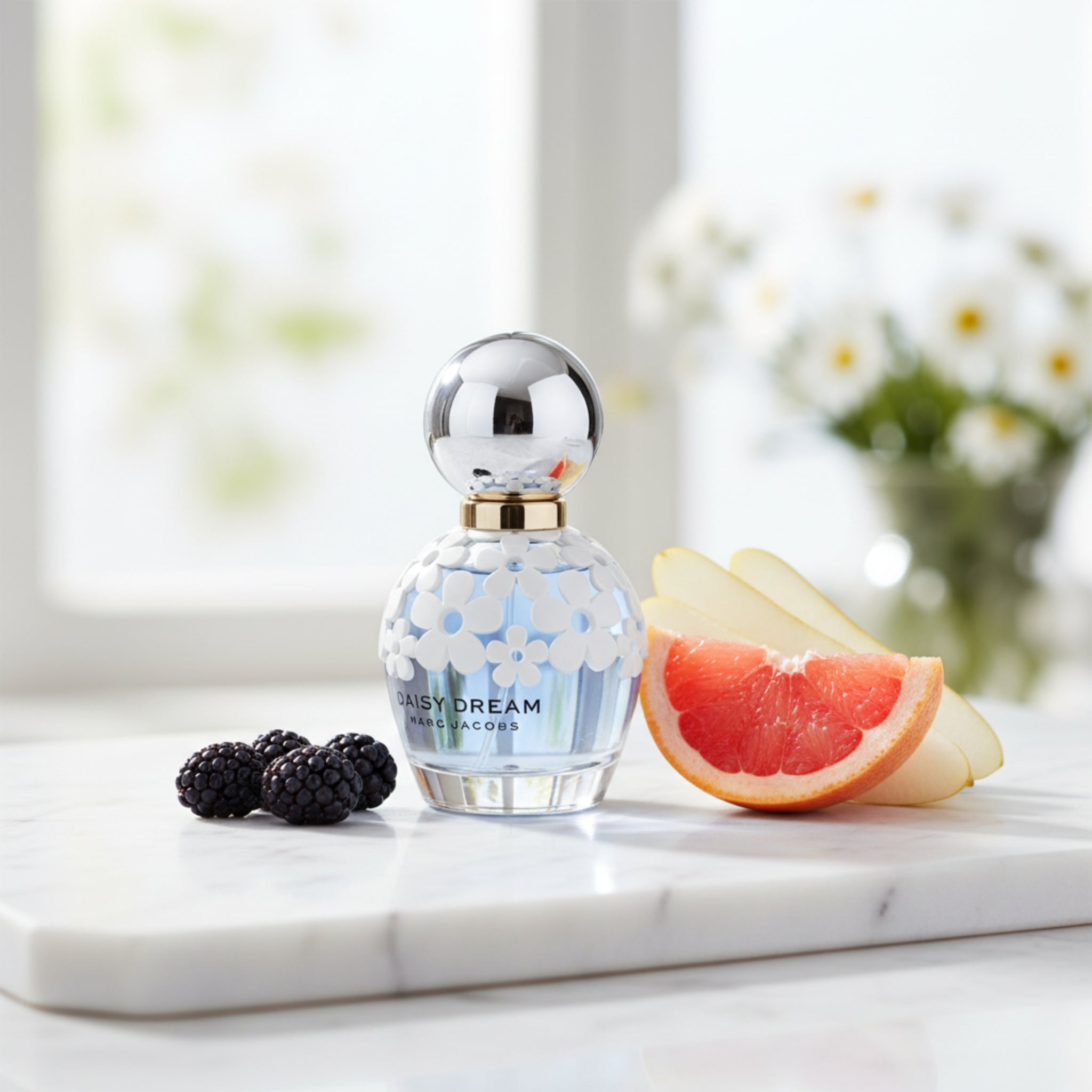 Perfume bottle with floral design on a white background