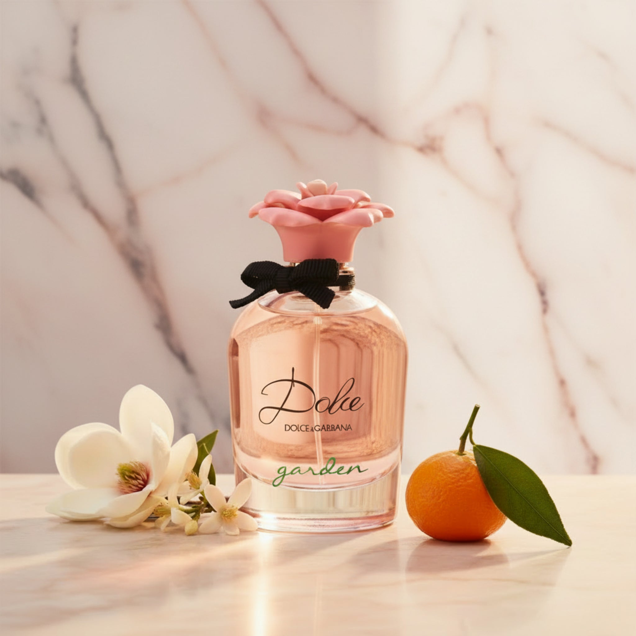 Dolce & Gabbana garden perfume bottle with pink rose on a white background