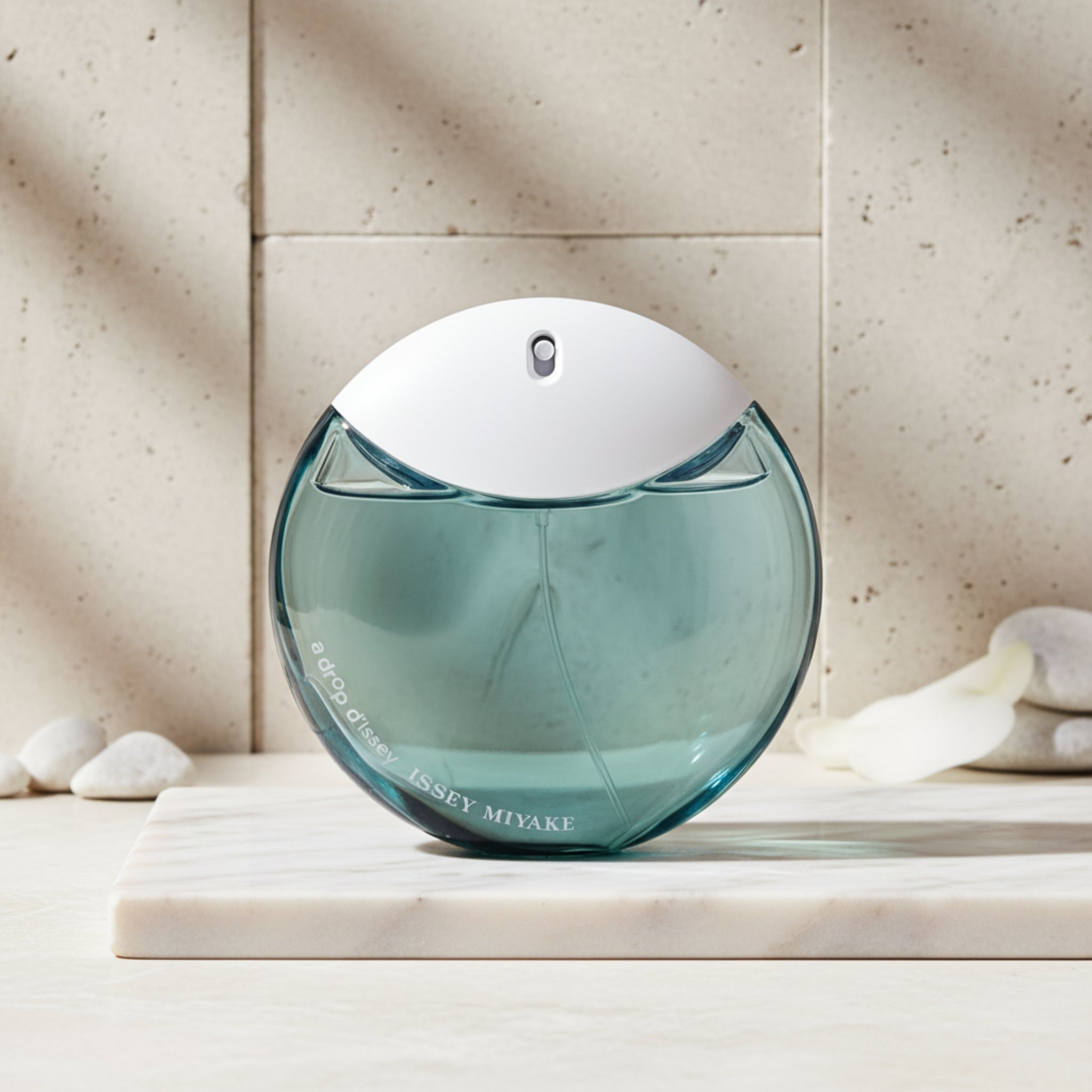 Perfume bottle with gradient blue design on a white background