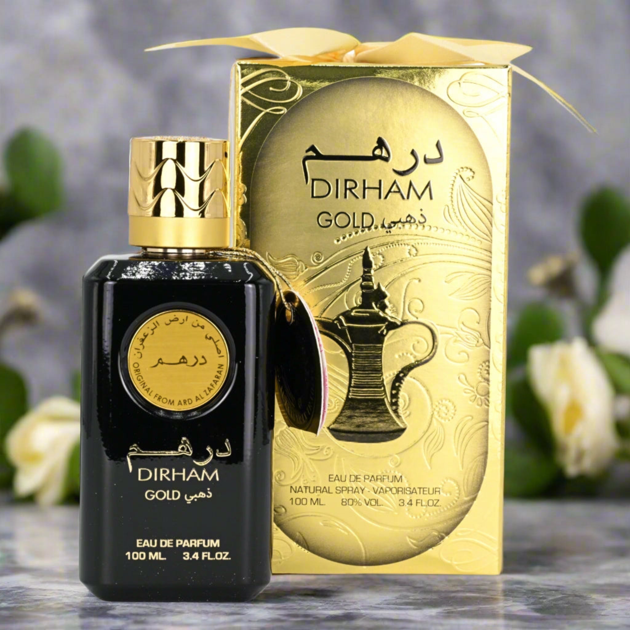 Dirham Gold perfume bottle and packaging with a decorative background