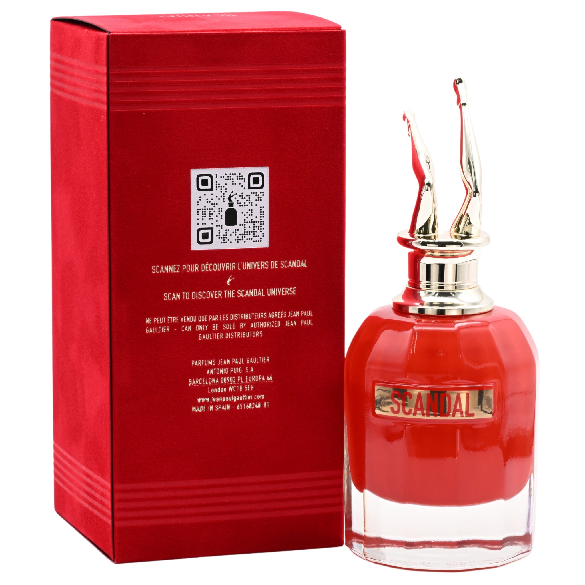 Red perfume bottle and packaging with 'Scandal' branding on a white background