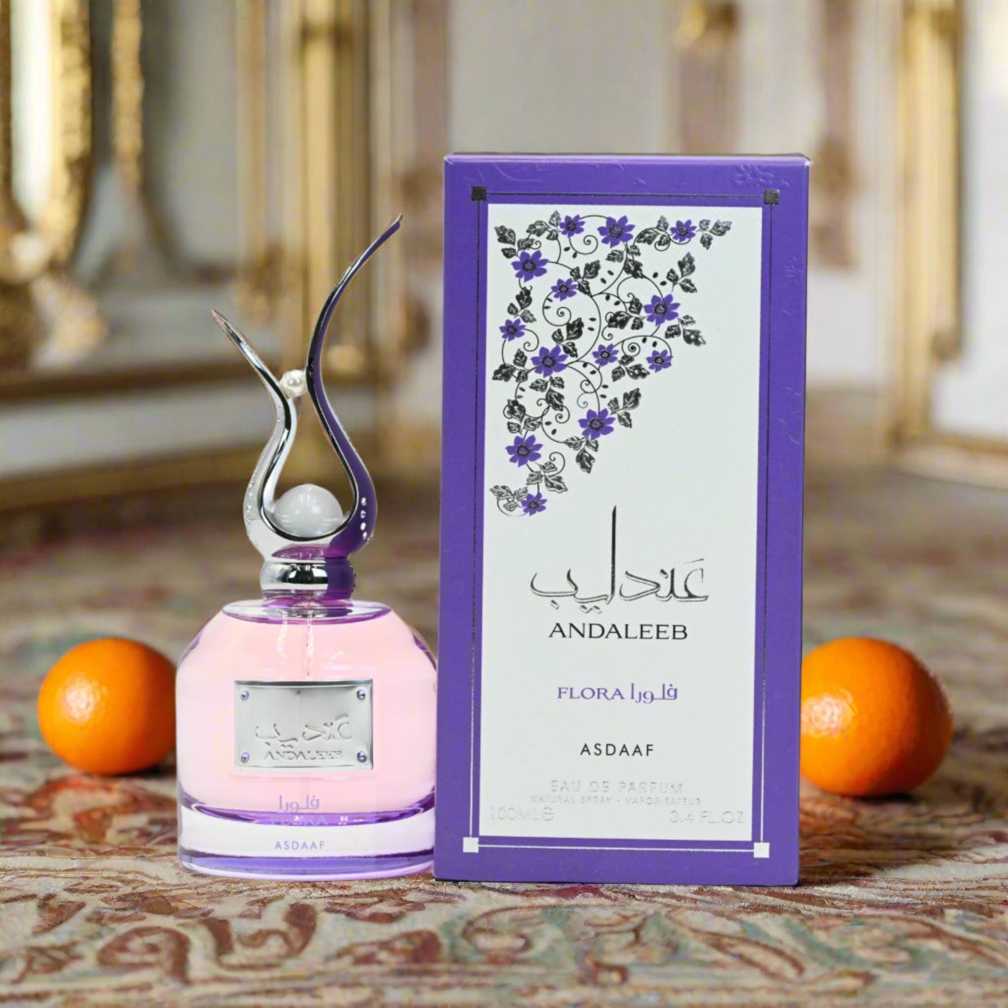 ANDALEEB perfume bottle and packaging on a patterned surface with oranges