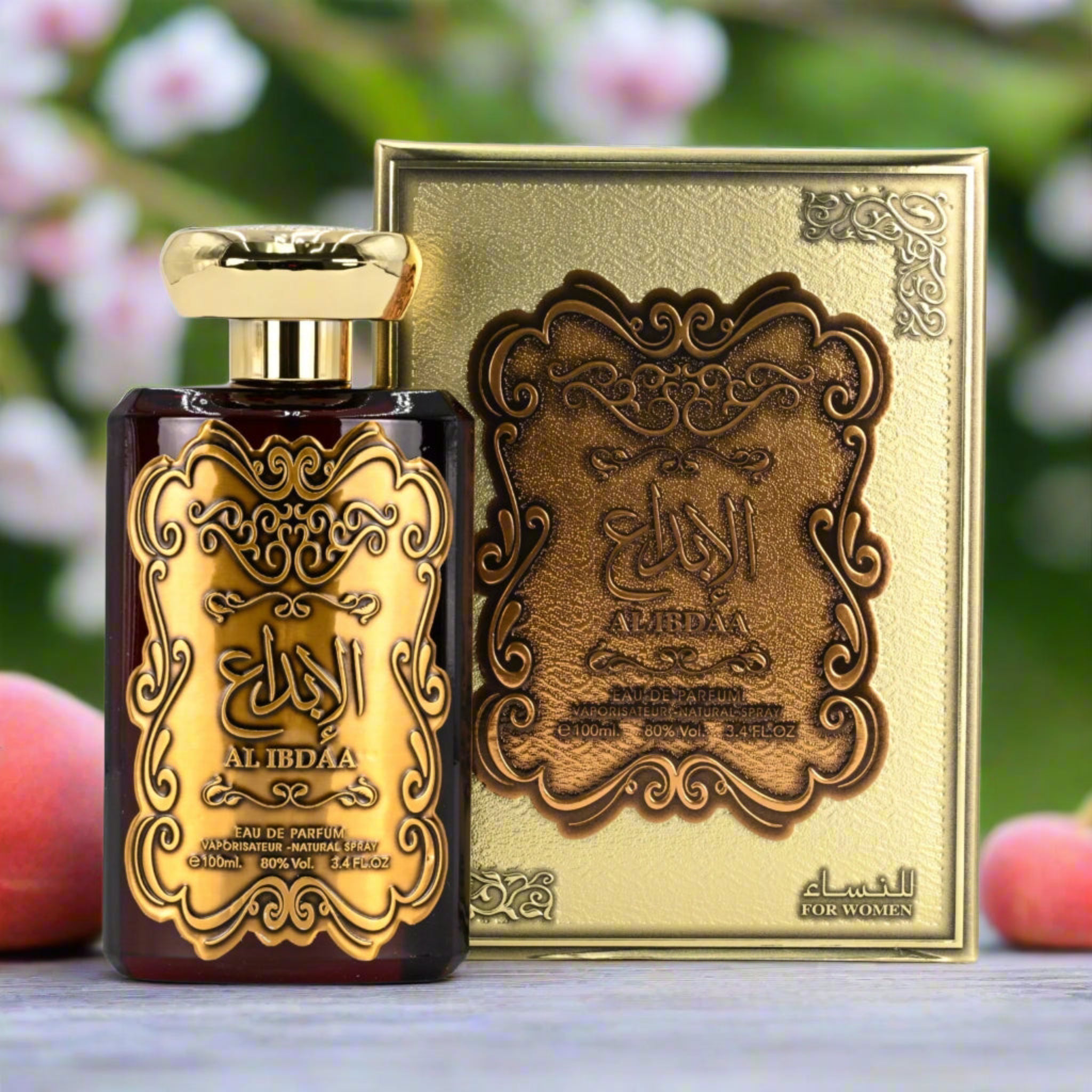 Perfume bottle and packaging with intricate designs on a blurred natural background