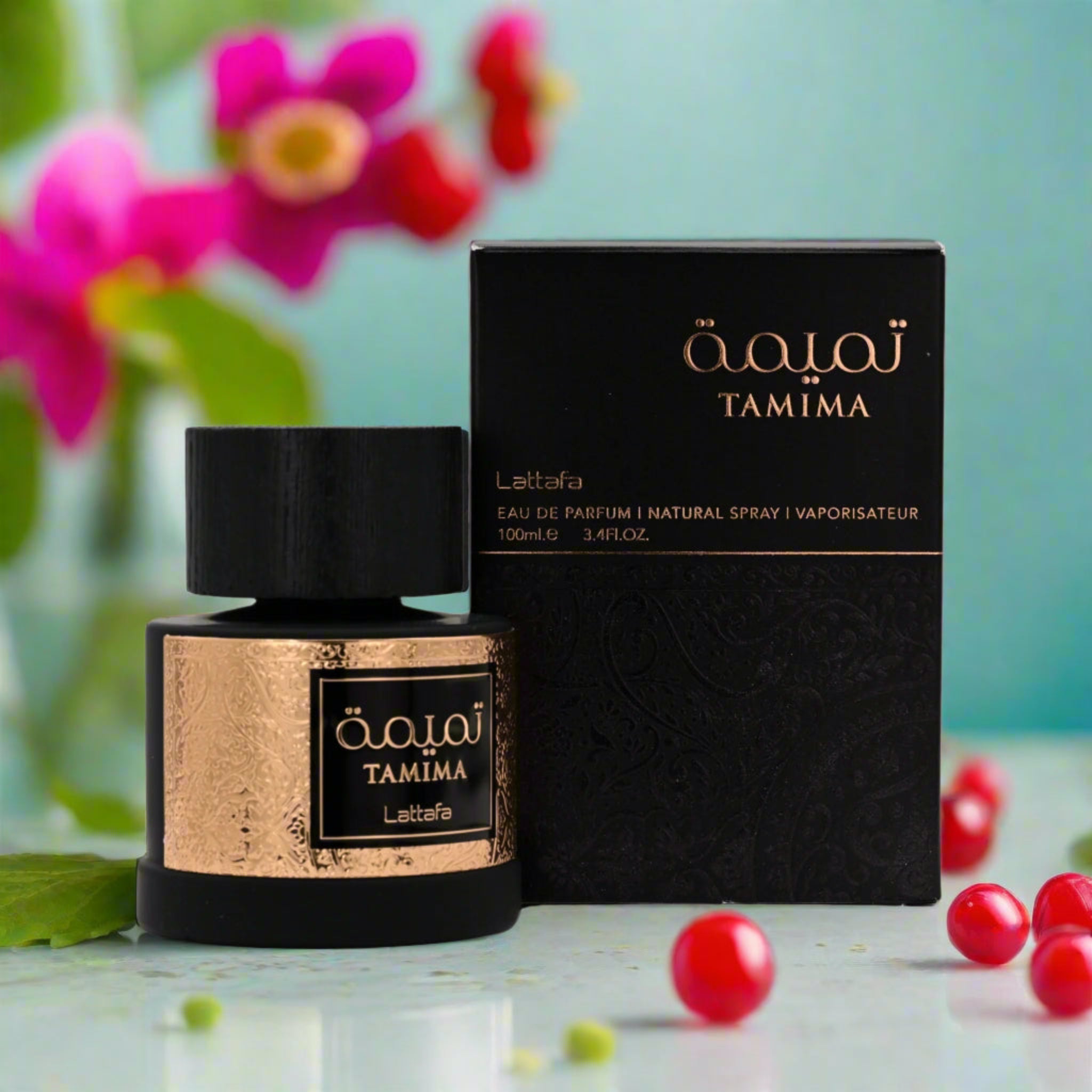 Tamima perfume bottle and packaging with flowers and berries in the background