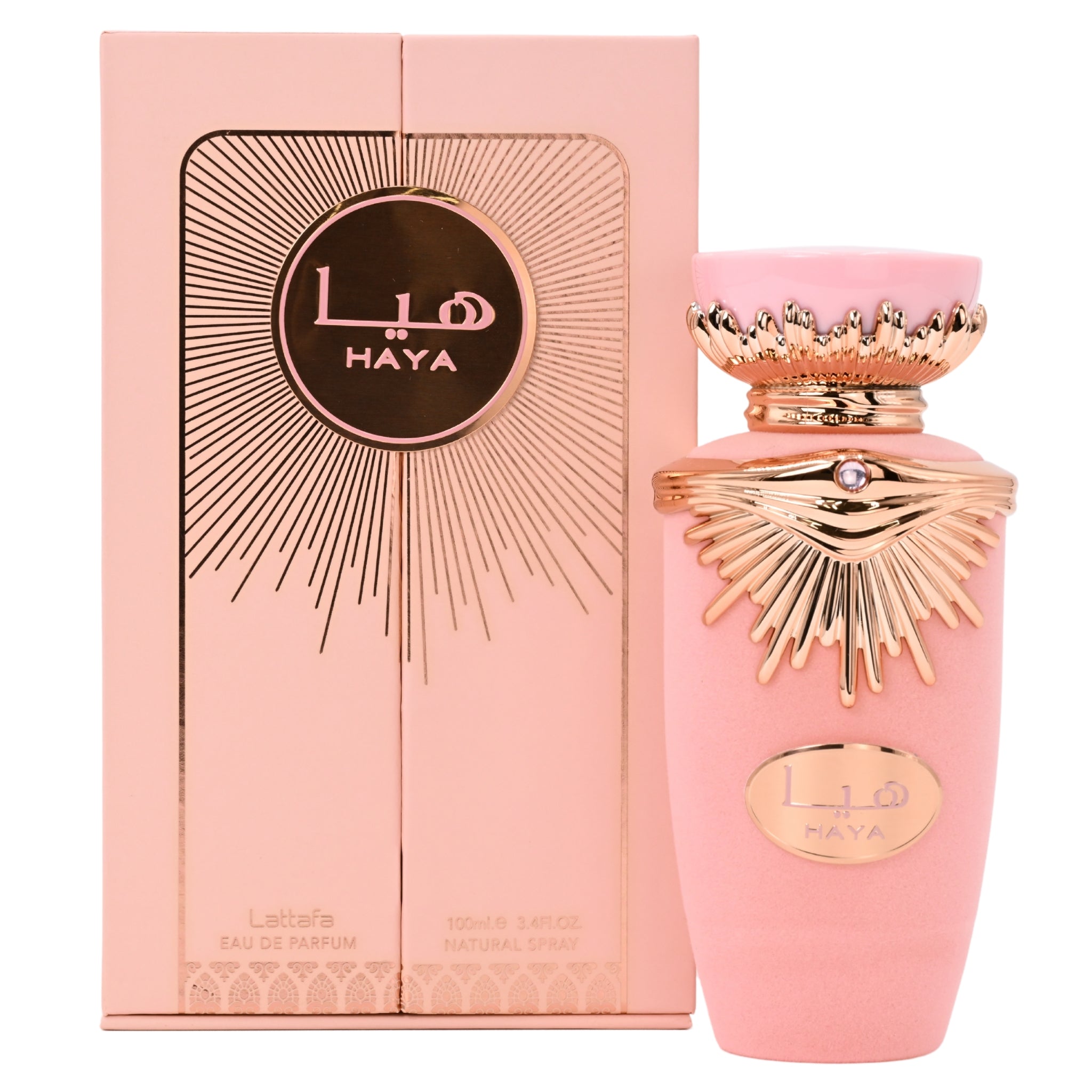 Pink Haya perfume bottle and packaging on a white background
