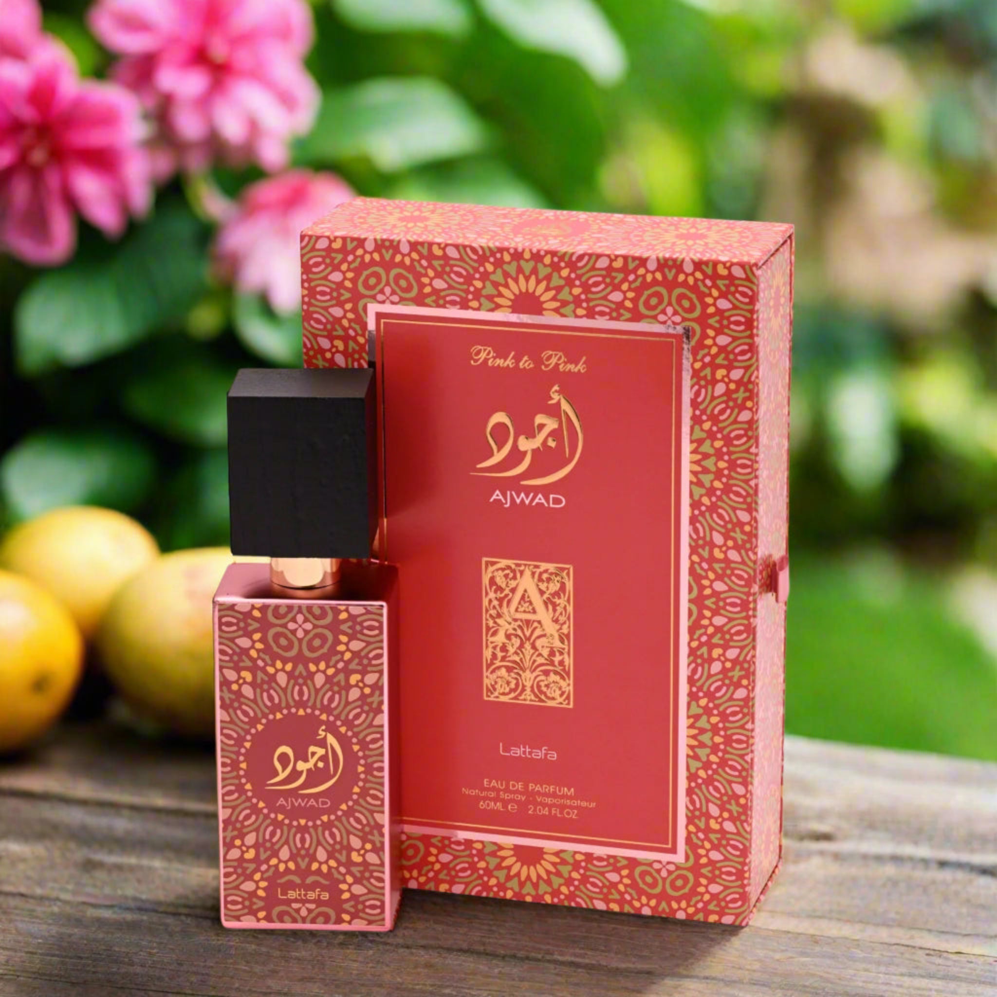 Perfume bottle and packaging with floral and fruit background