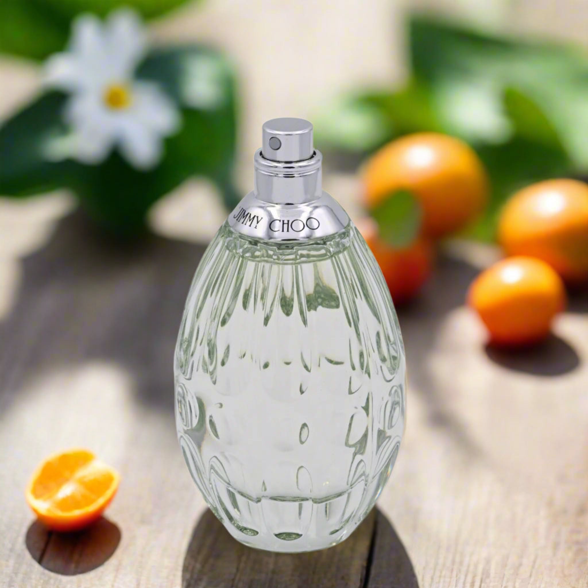 Perfume bottle with silver cap on a white background