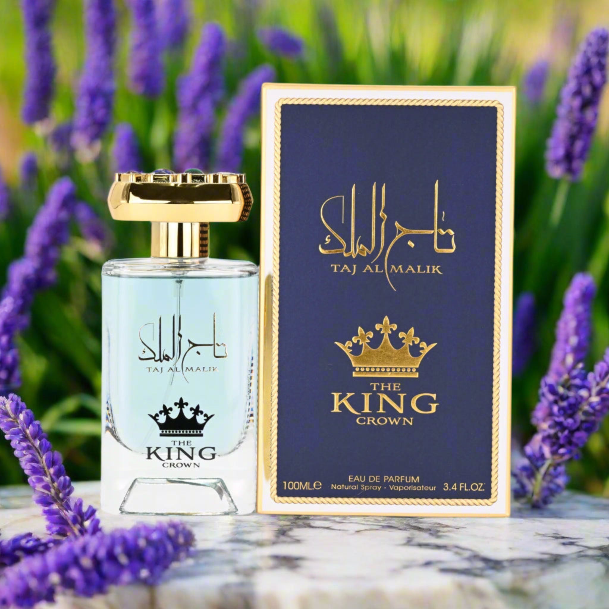 Perfume bottle and packaging with 'Taj Al Malik' branding against a blurred floral background