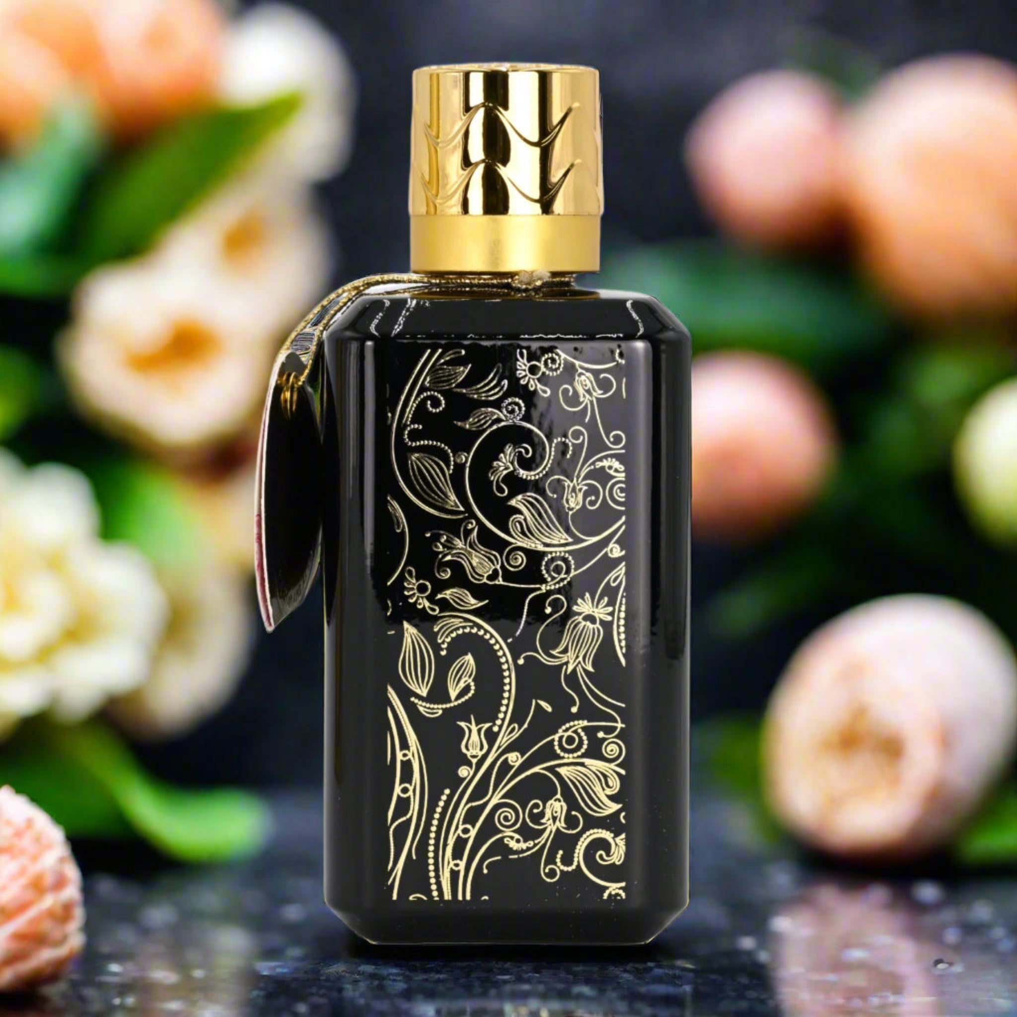 Decorative black perfume bottle with gold design and cap, set against a floral background.