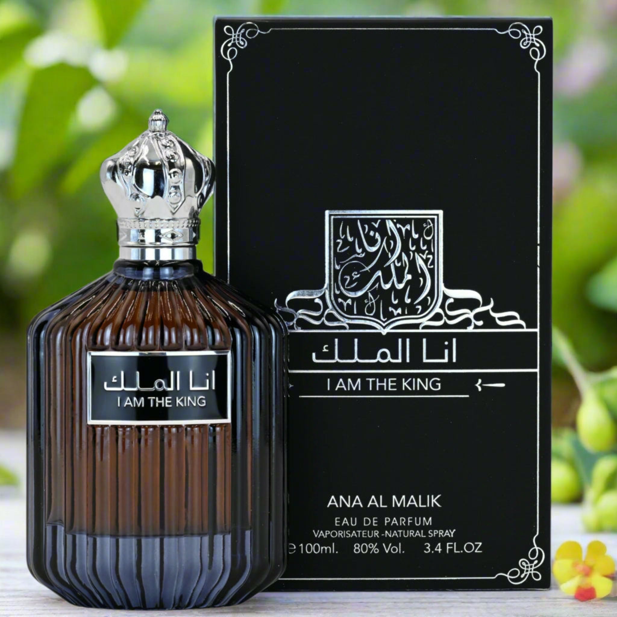 Perfume bottle and packaging of 'Ana Al Malik' with a decorative background