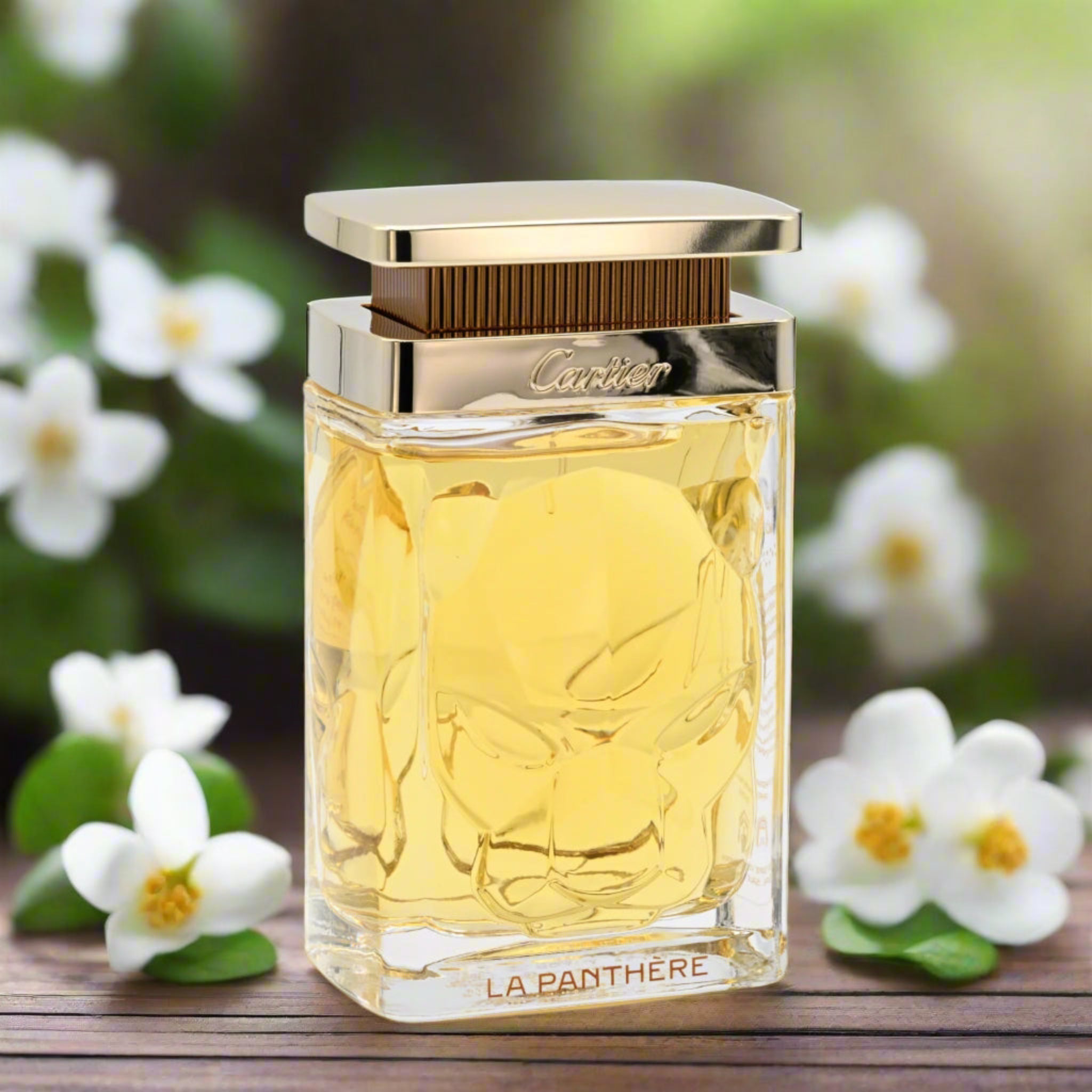 Cartier La Panthere perfume bottle with a floral background