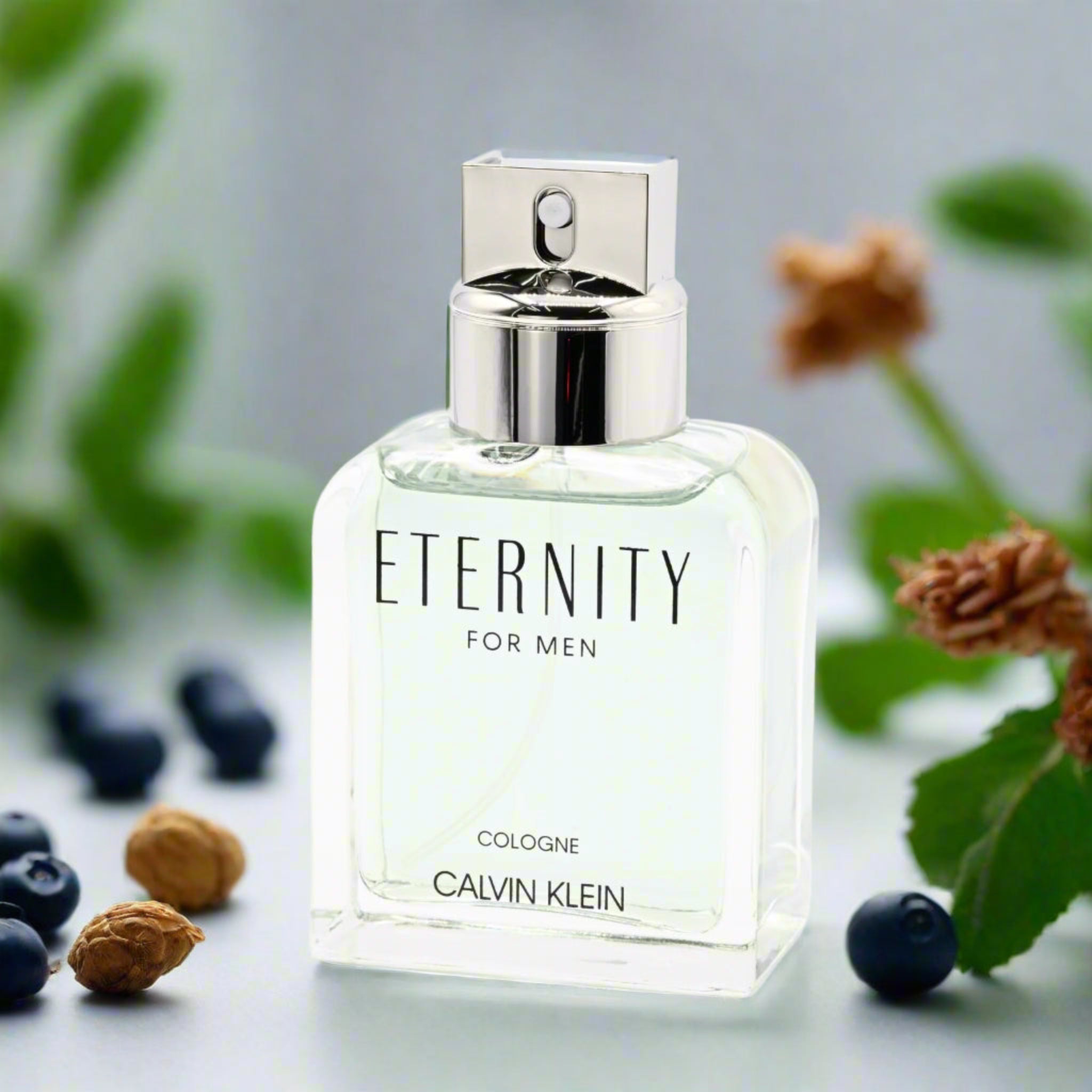 Calvin Klein Eternity for Men cologne bottle with natural elements in the background