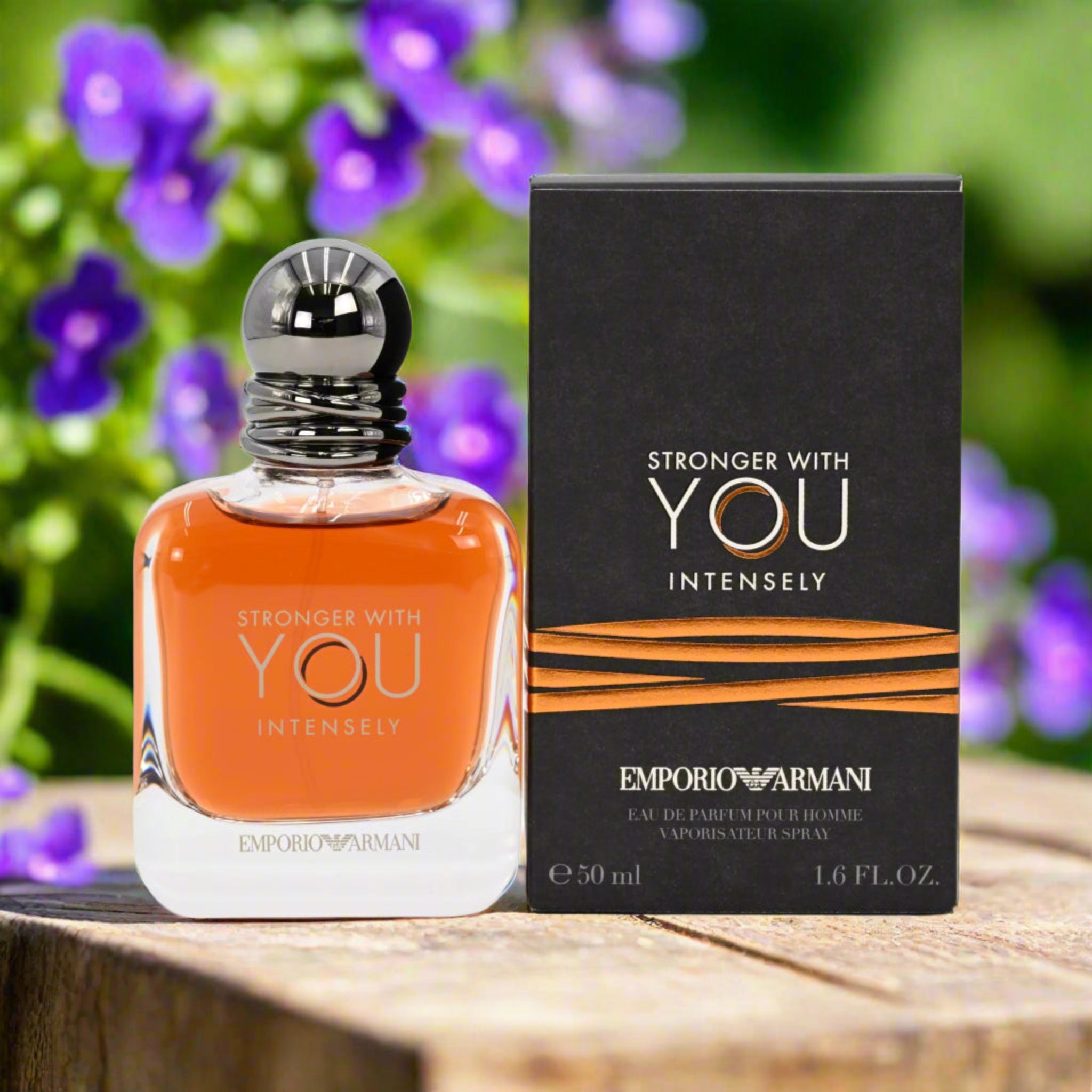 Emporio Armani perfume bottle and packaging with a floral background