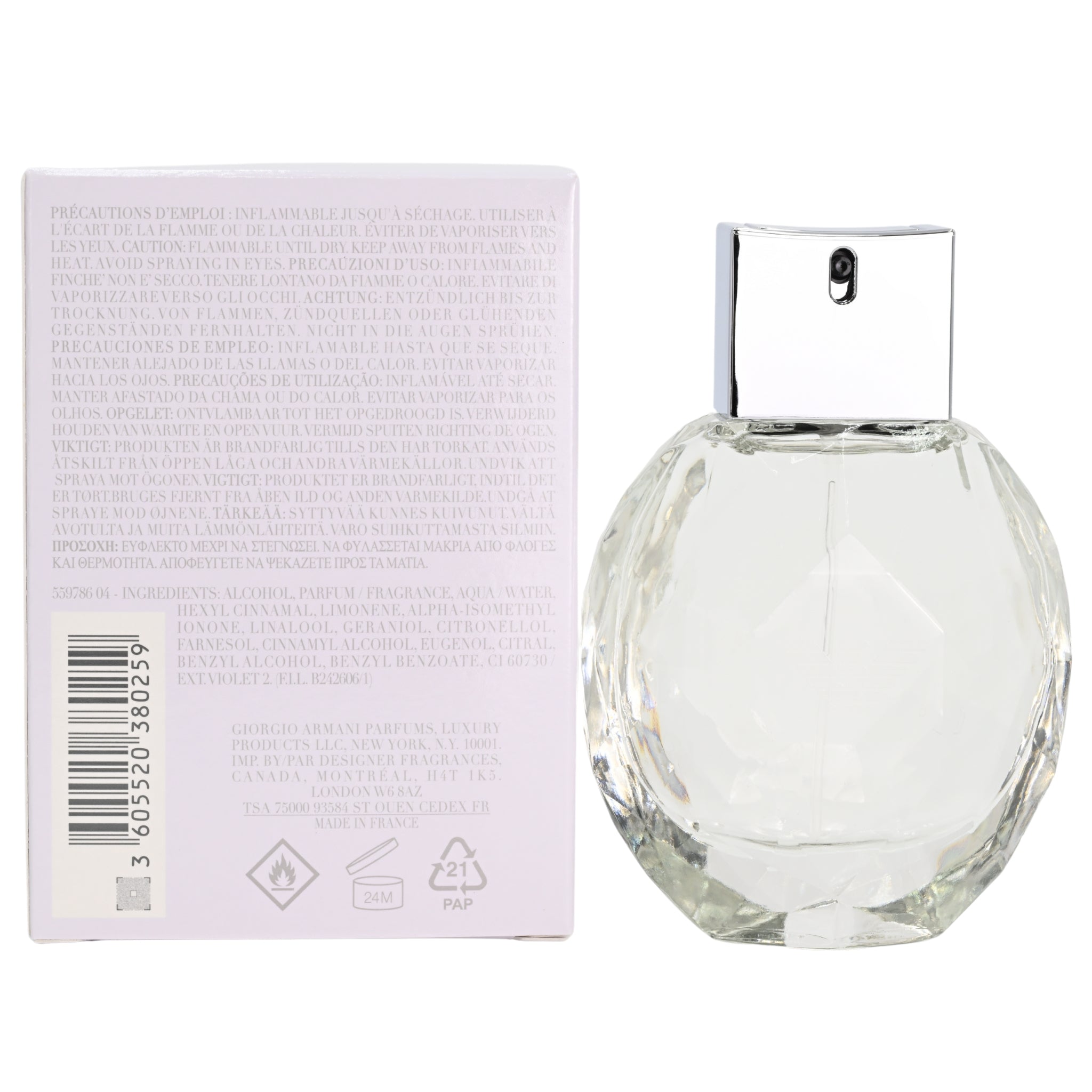 Clear glass perfume bottle with packaging on a white background