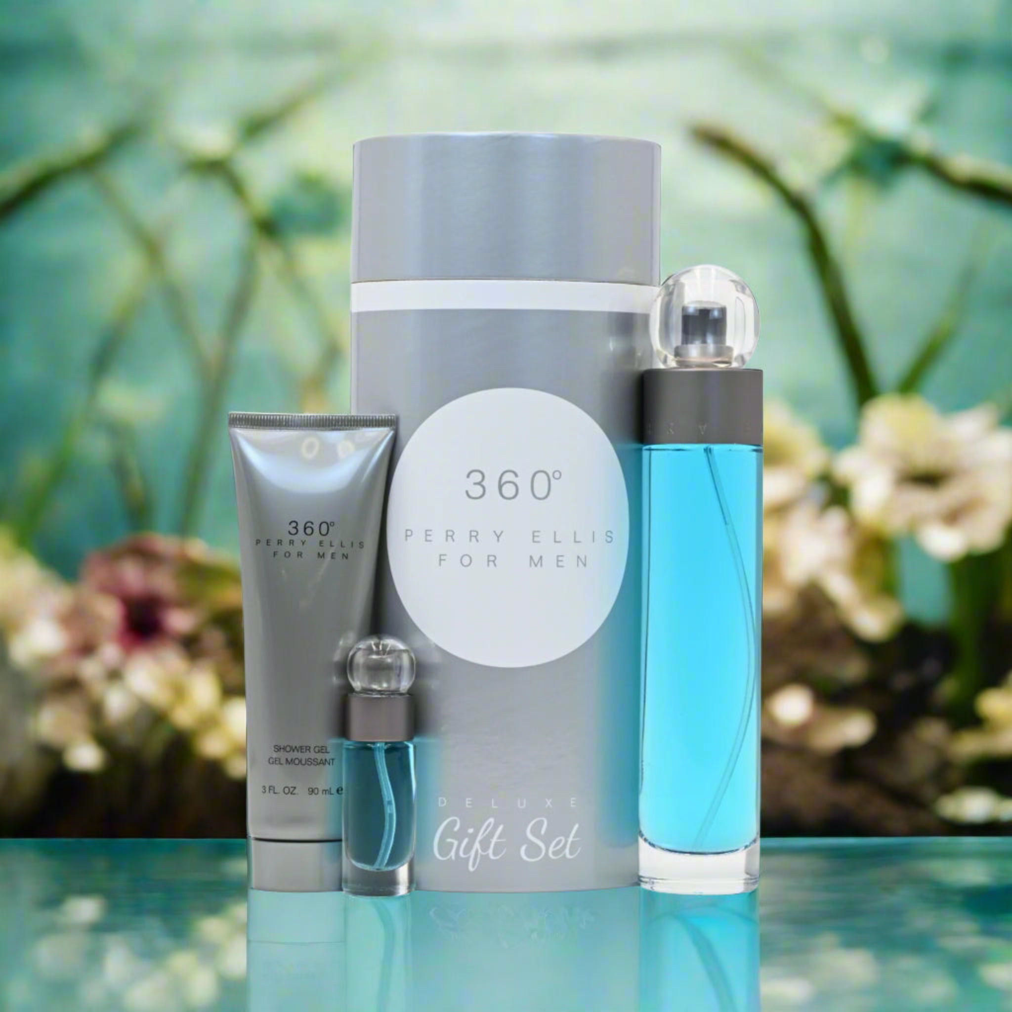 Perry Ellis 360° men's grooming gift set with a blue bottle and silver tube on a reflective surface.