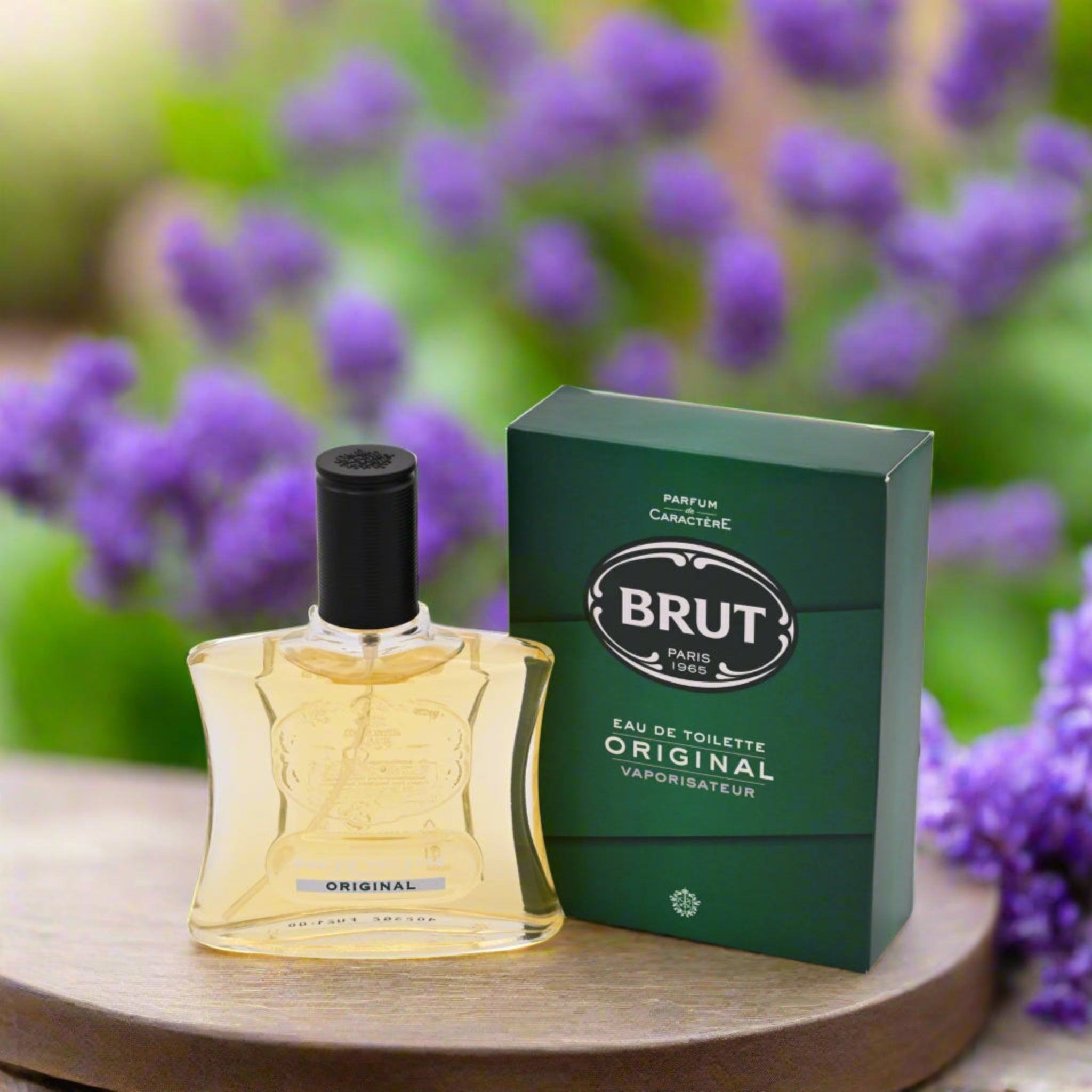 Brut perfume bottle and packaging with a blurred lavender background