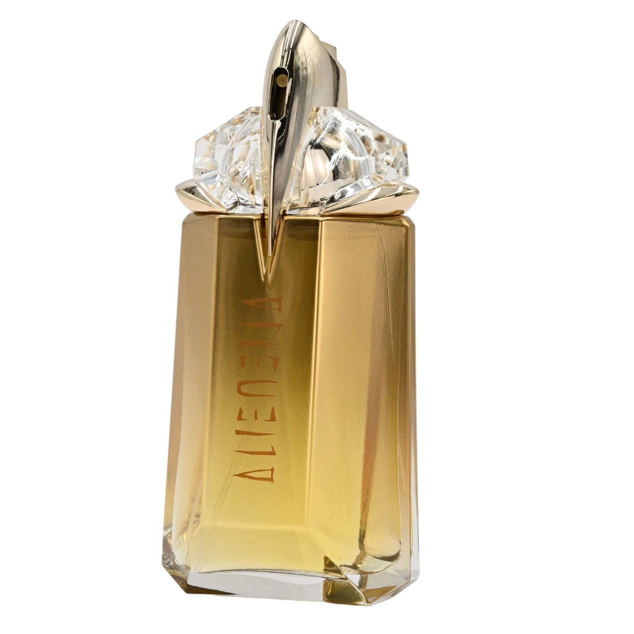 Gold perfume bottle with diamond-like cap on a white background