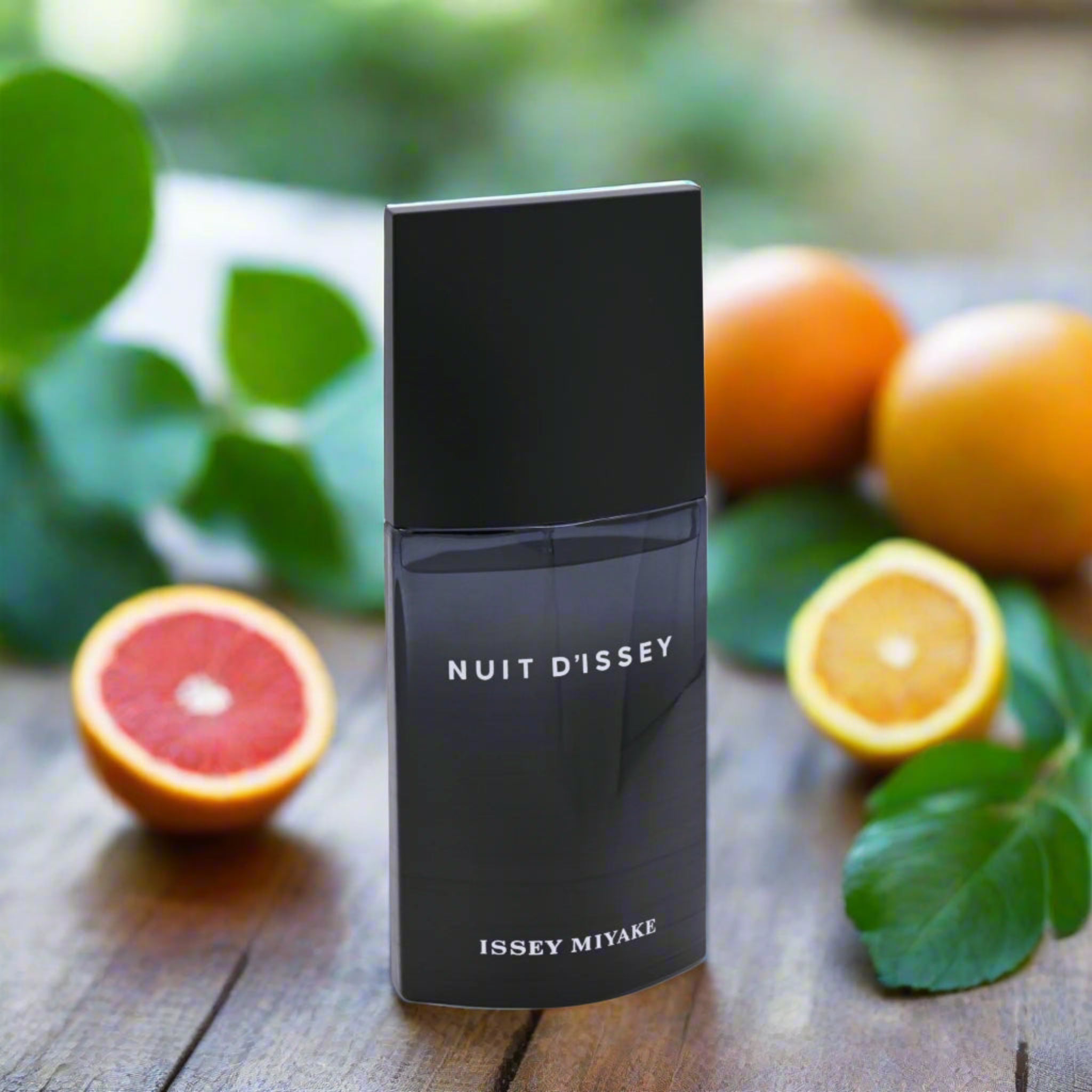 Black perfume bottle labeled 'Nuit D'Issey' by Issey Miyake on a white background