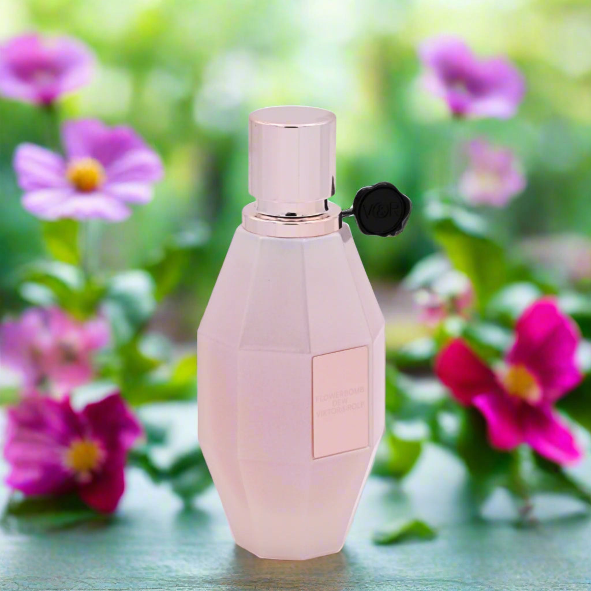 Pink perfume bottle with a blurred floral background