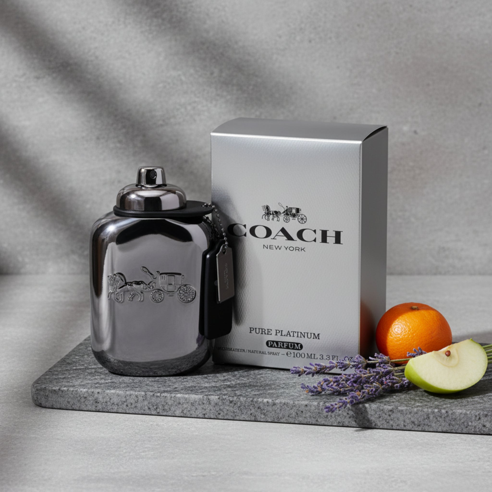 Coach Pure Platinum perfume bottle and packaging on a white background