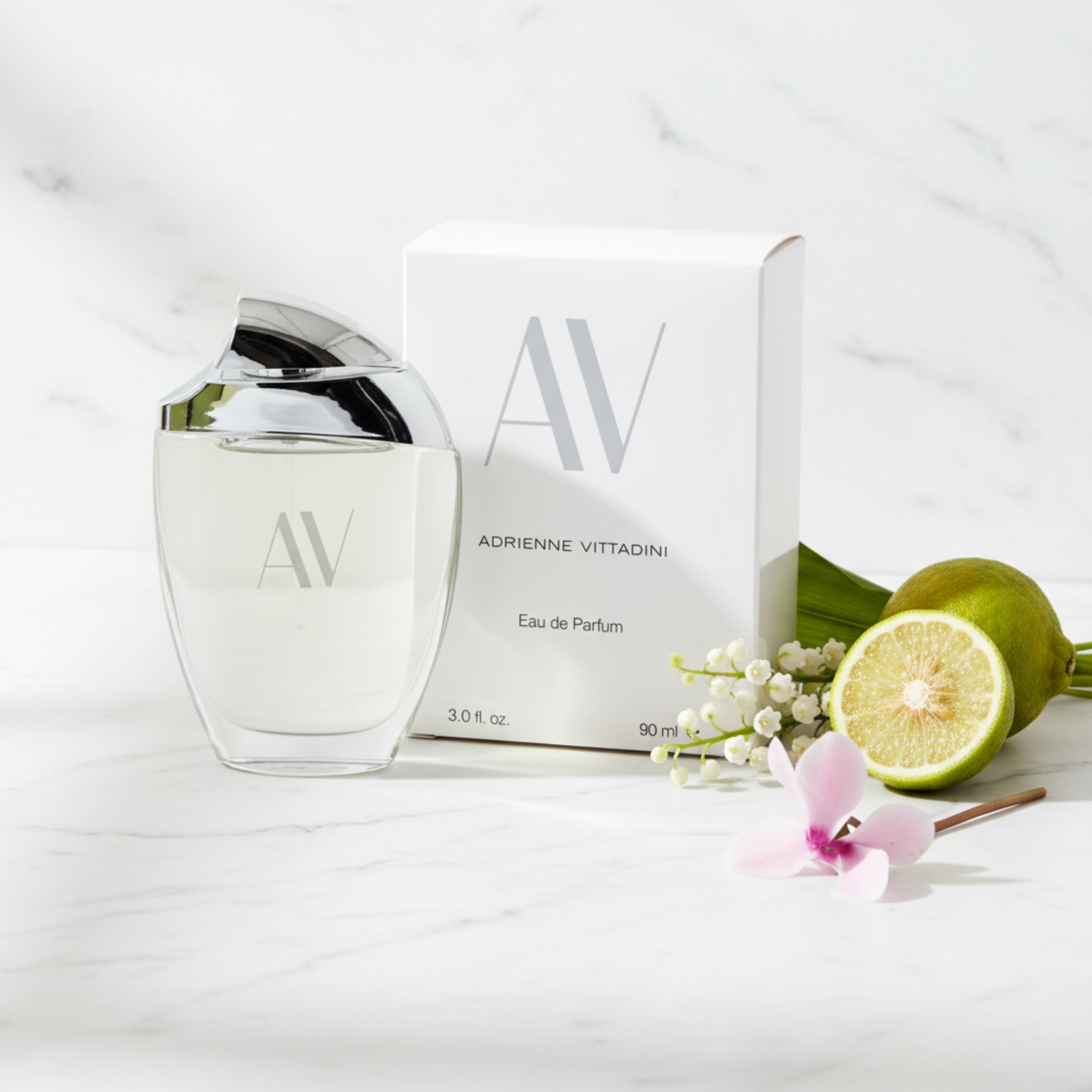 Adrienne Vittadini Eau de Parfum bottle and packaging on a white background