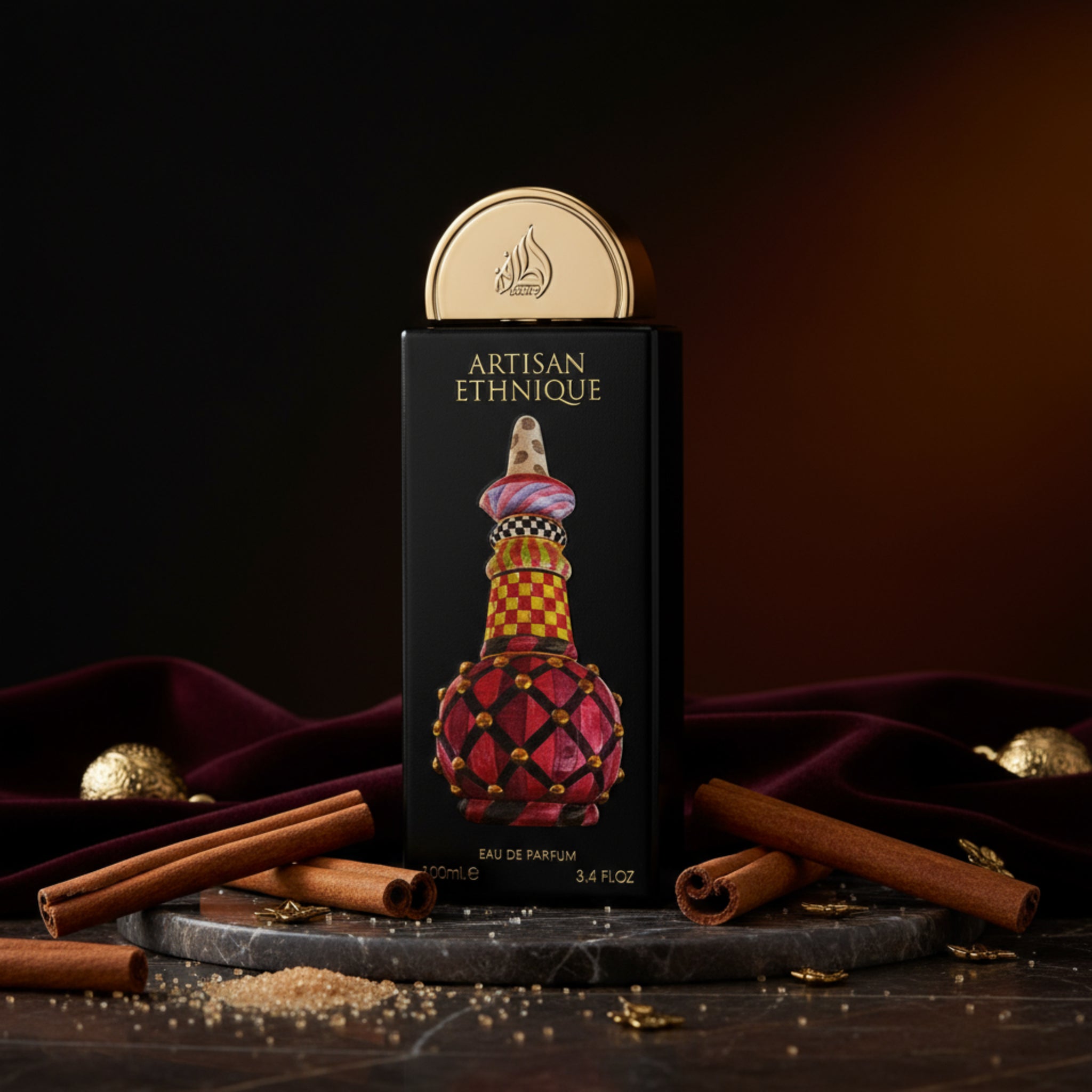 Perfume bottle with decorative design on a black box labeled 'Artisan Ethnie'.
