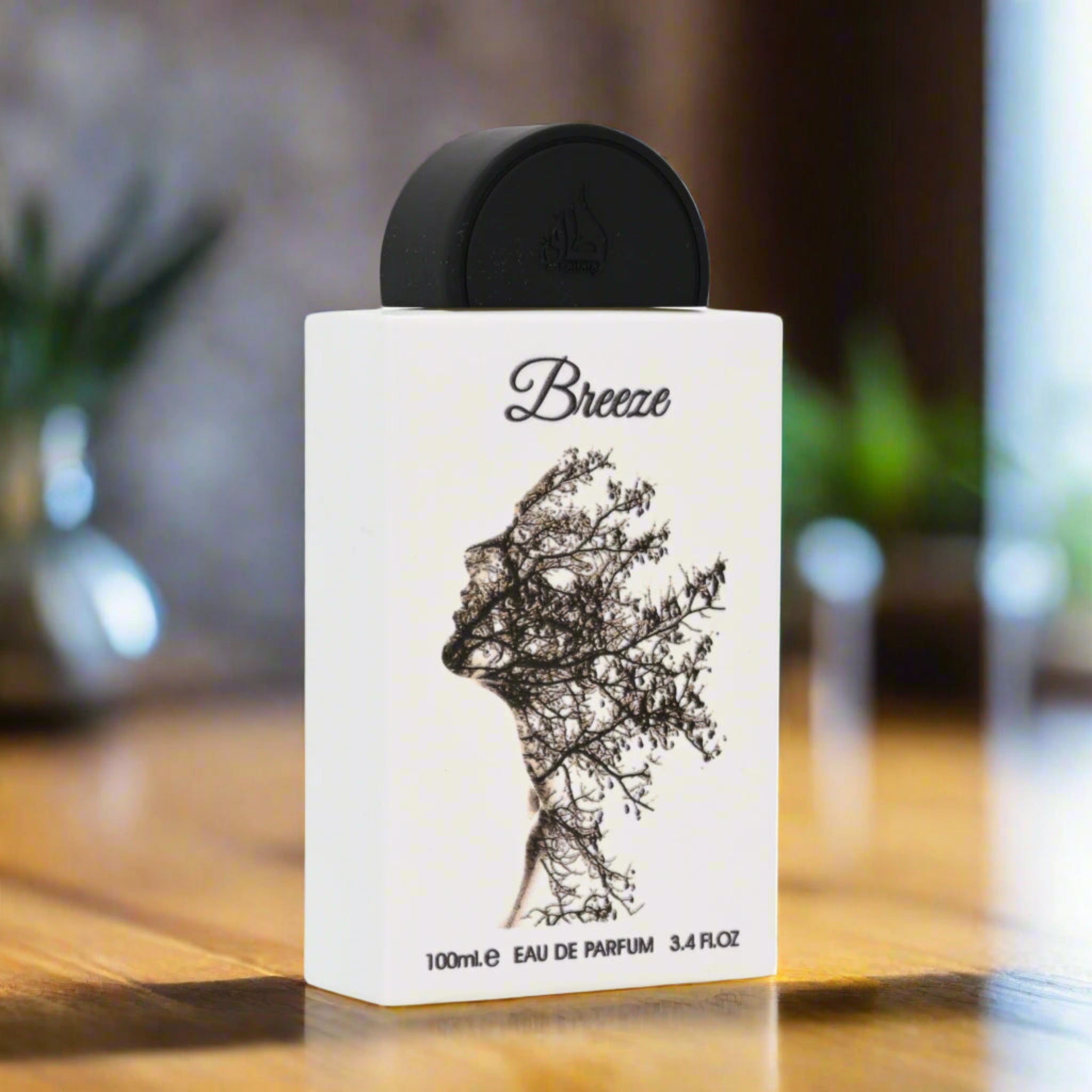 Perfume bottle labeled 'Breeze' on a wooden surface with a blurred background