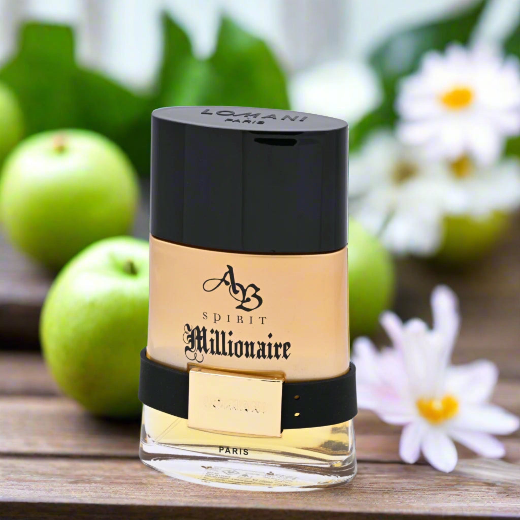 Perfume bottle labeled 'AB Spirit Millionaire' with green apples and flowers in the background