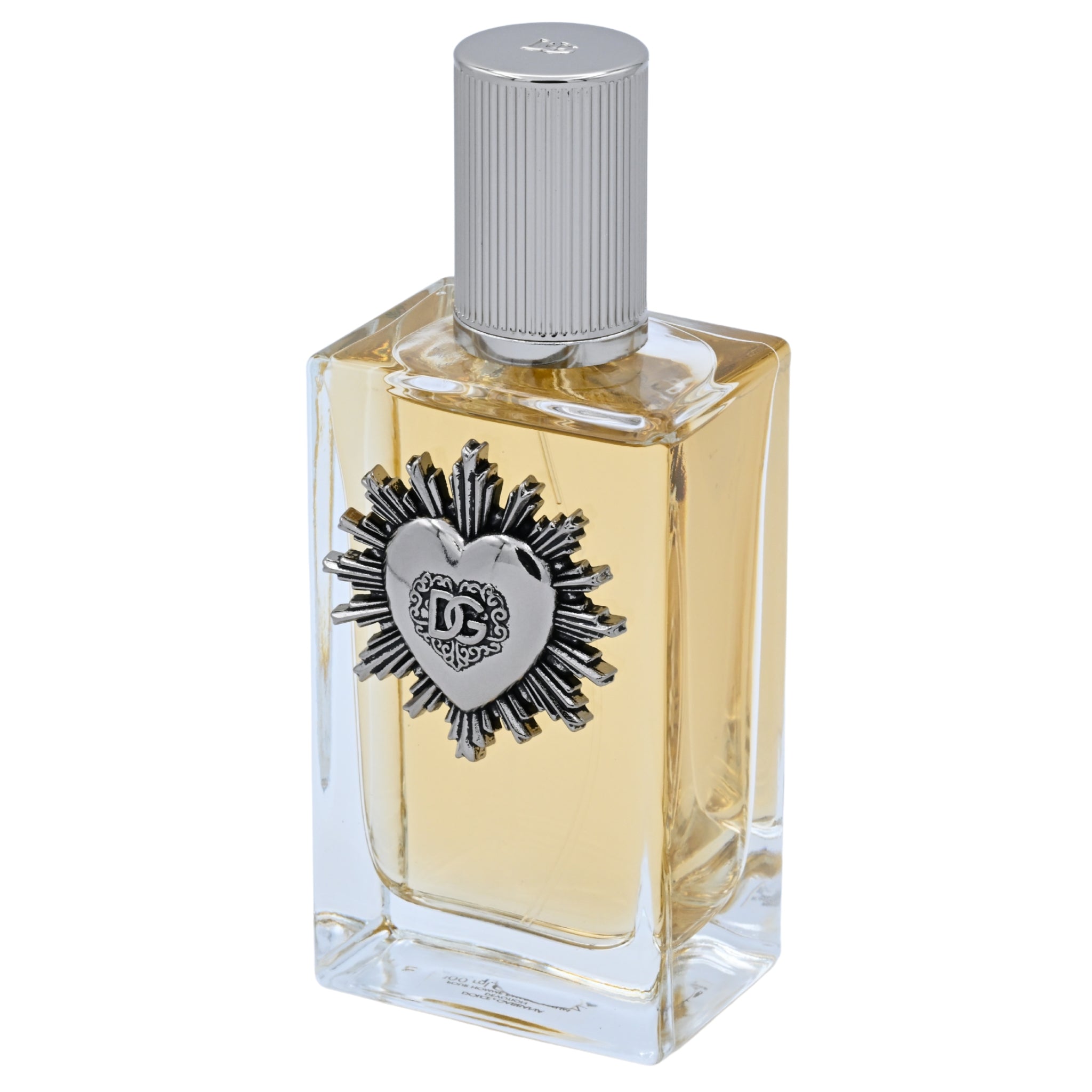 Perfume bottle with silver cap and decorative heart emblem on a white background