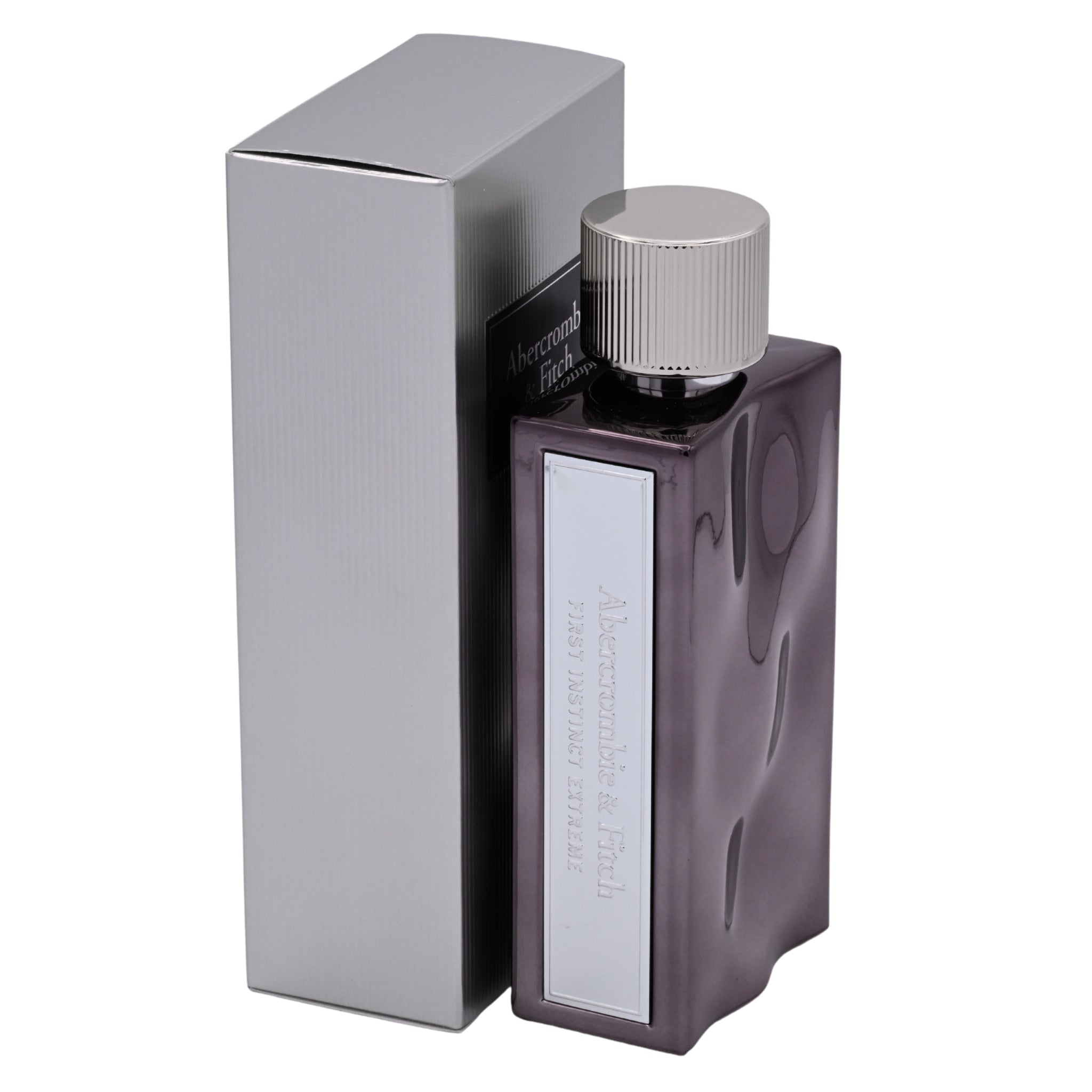 Perfume bottle with silver cap and packaging on a white background