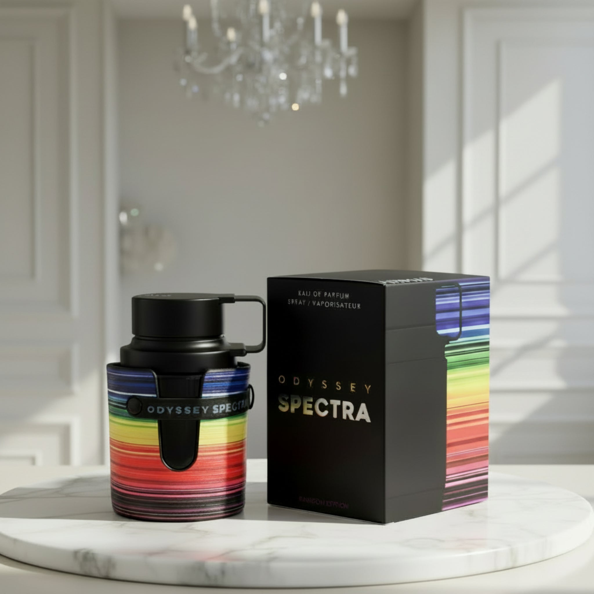 Odyssey Spectra perfume bottle and packaging on a marble surface with a chandelier in the background.