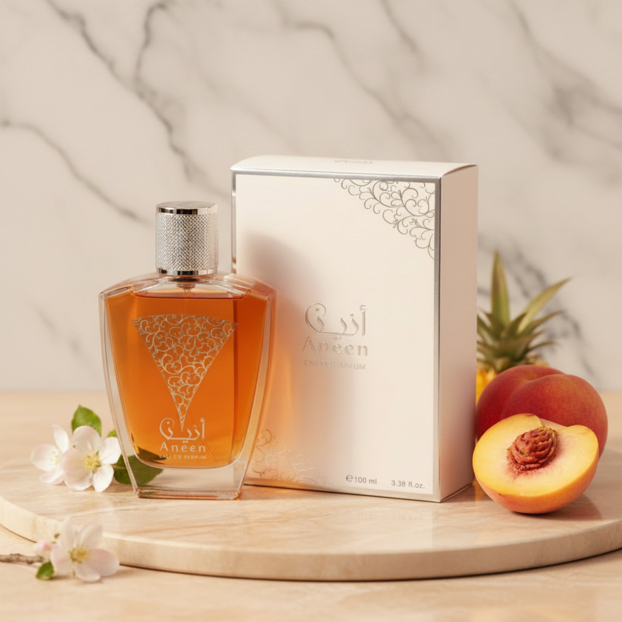 Perfume bottle and packaging with 'Aneen' branding on a white background