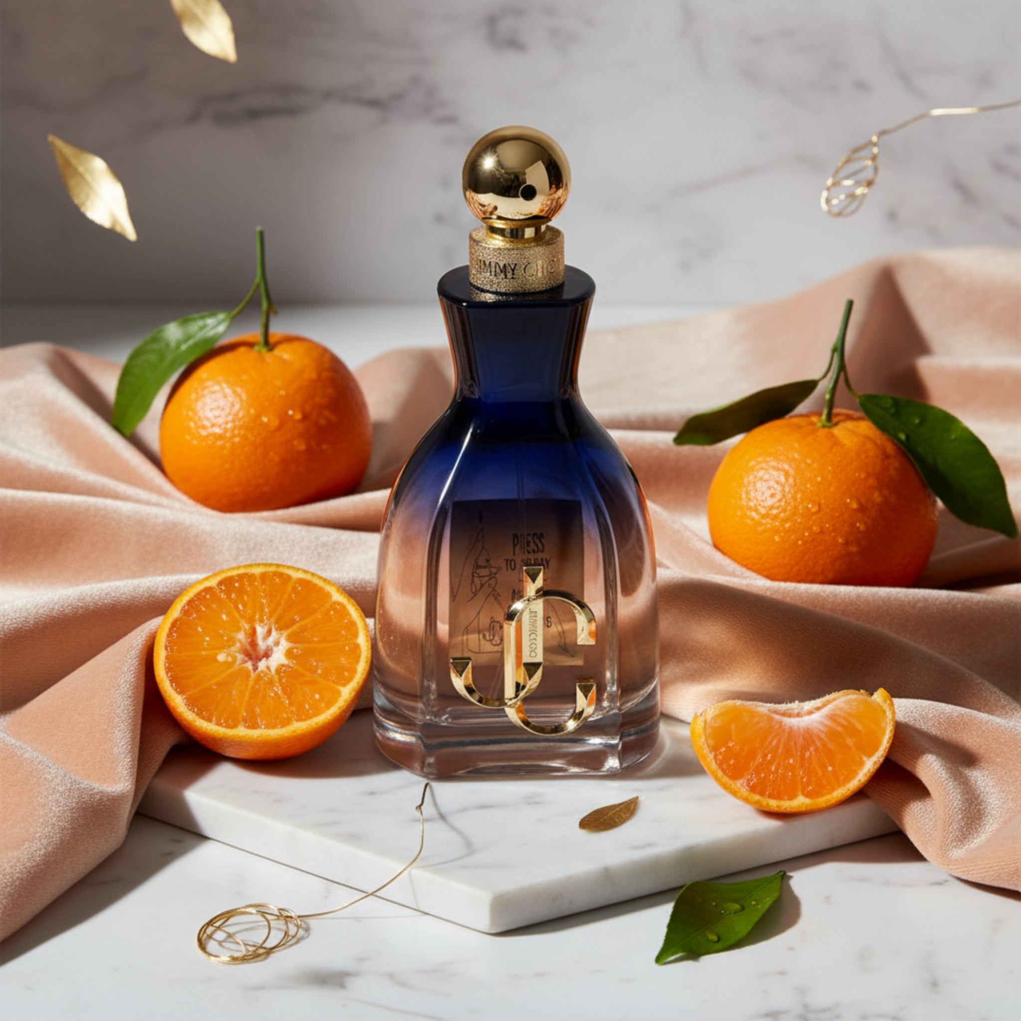 Blue perfume bottle with gold cap and details on a white background