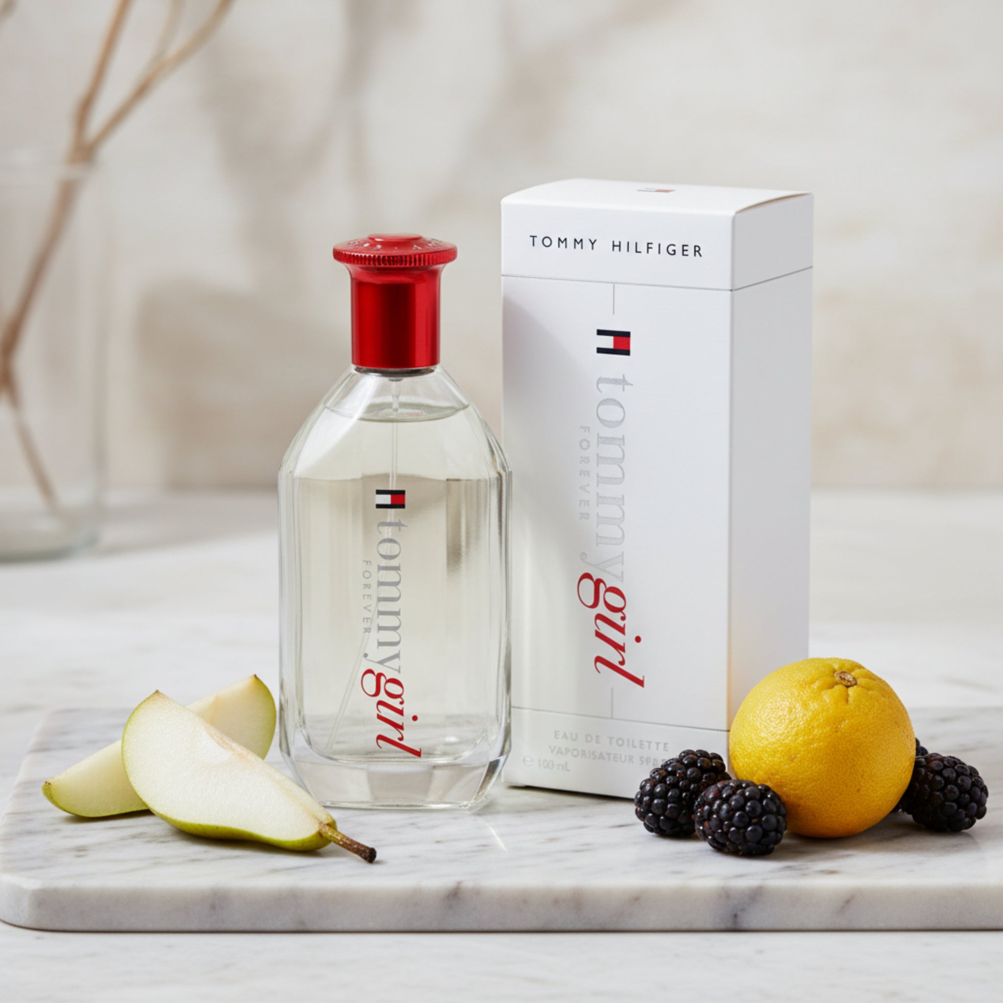 Tommy Hilfiger perfume bottle and packaging on a white background