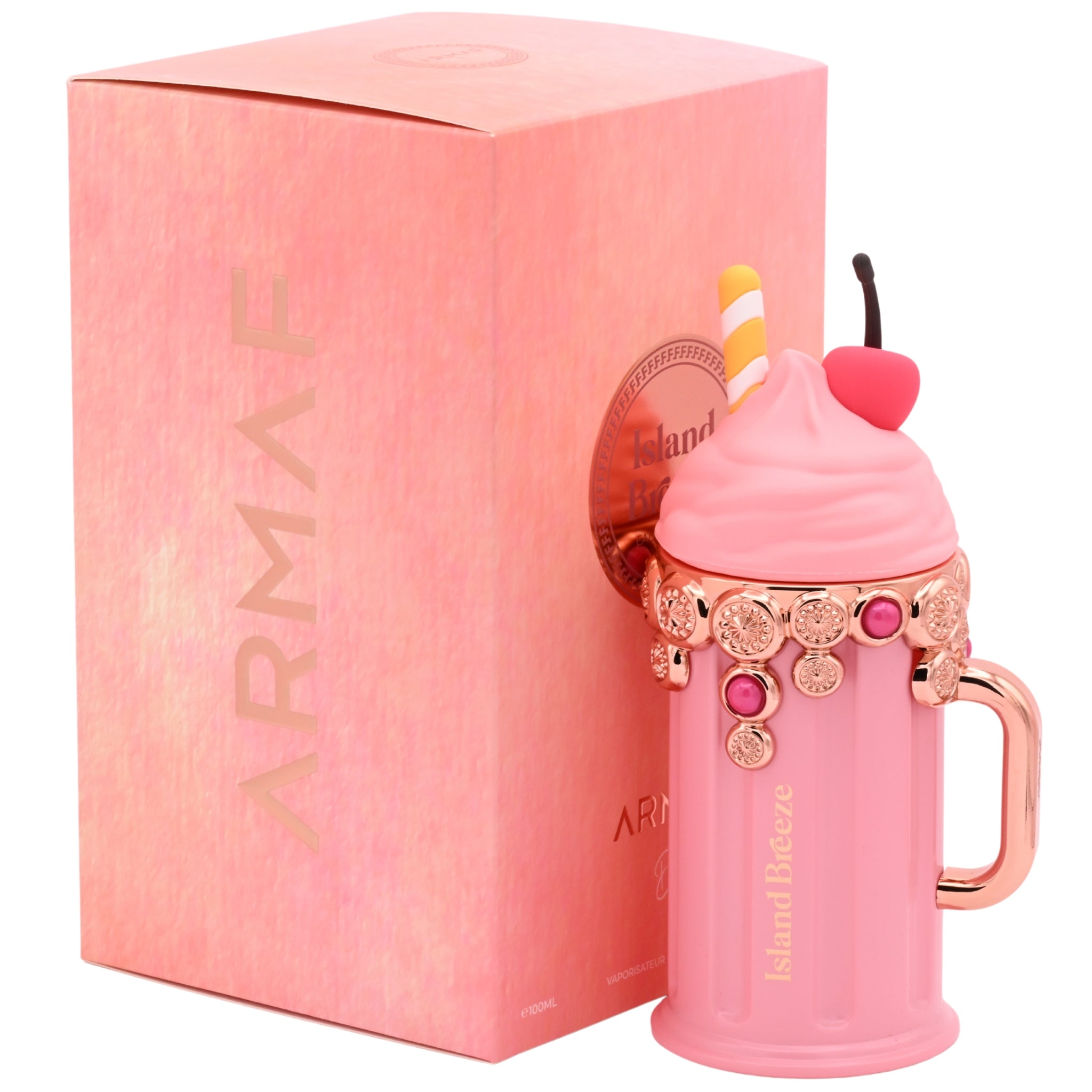 Pink dessert-shaped perfume bottle with 'Island Breeze' label packaging on a white background