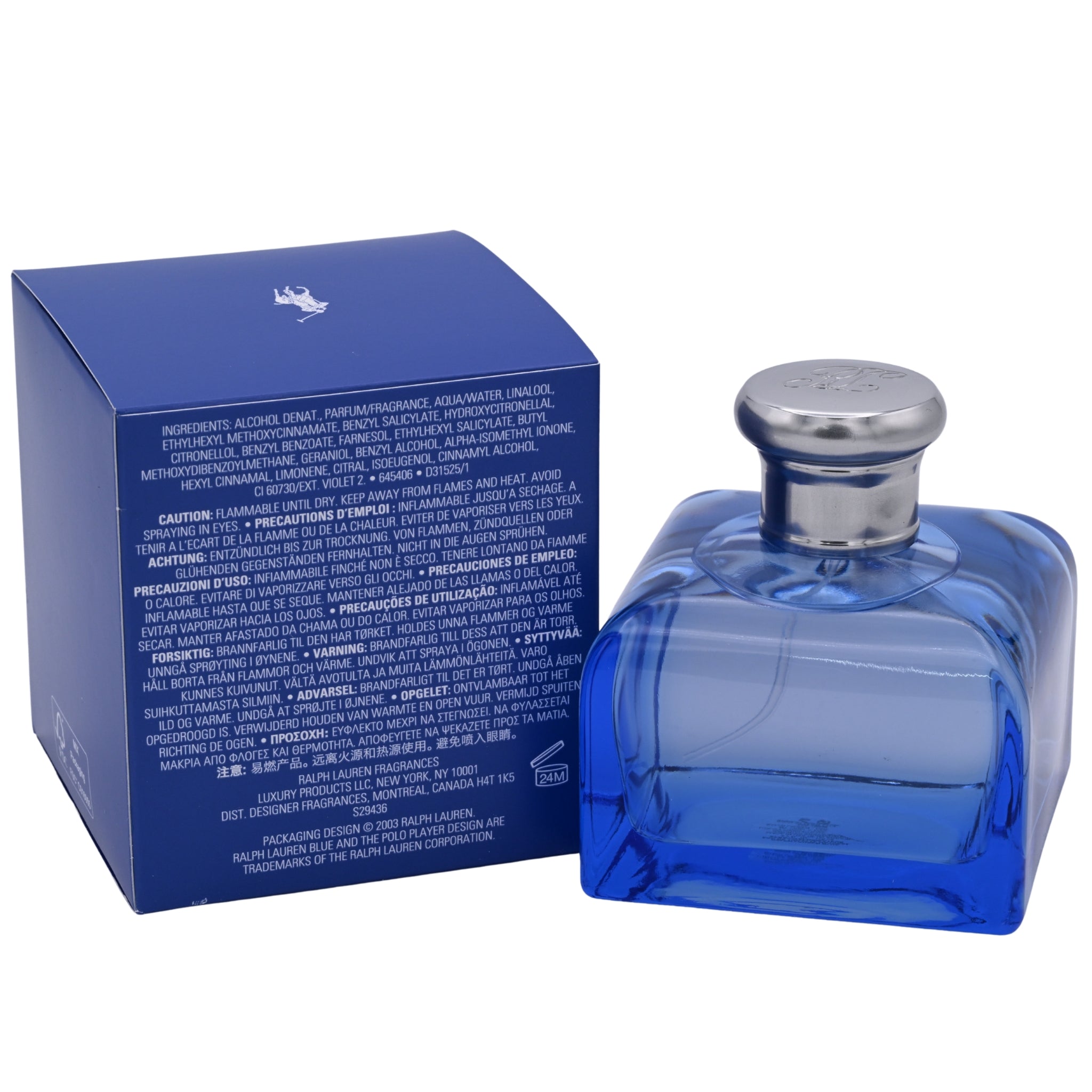 Blue perfume bottle with silver cap next to its packaging on a white background