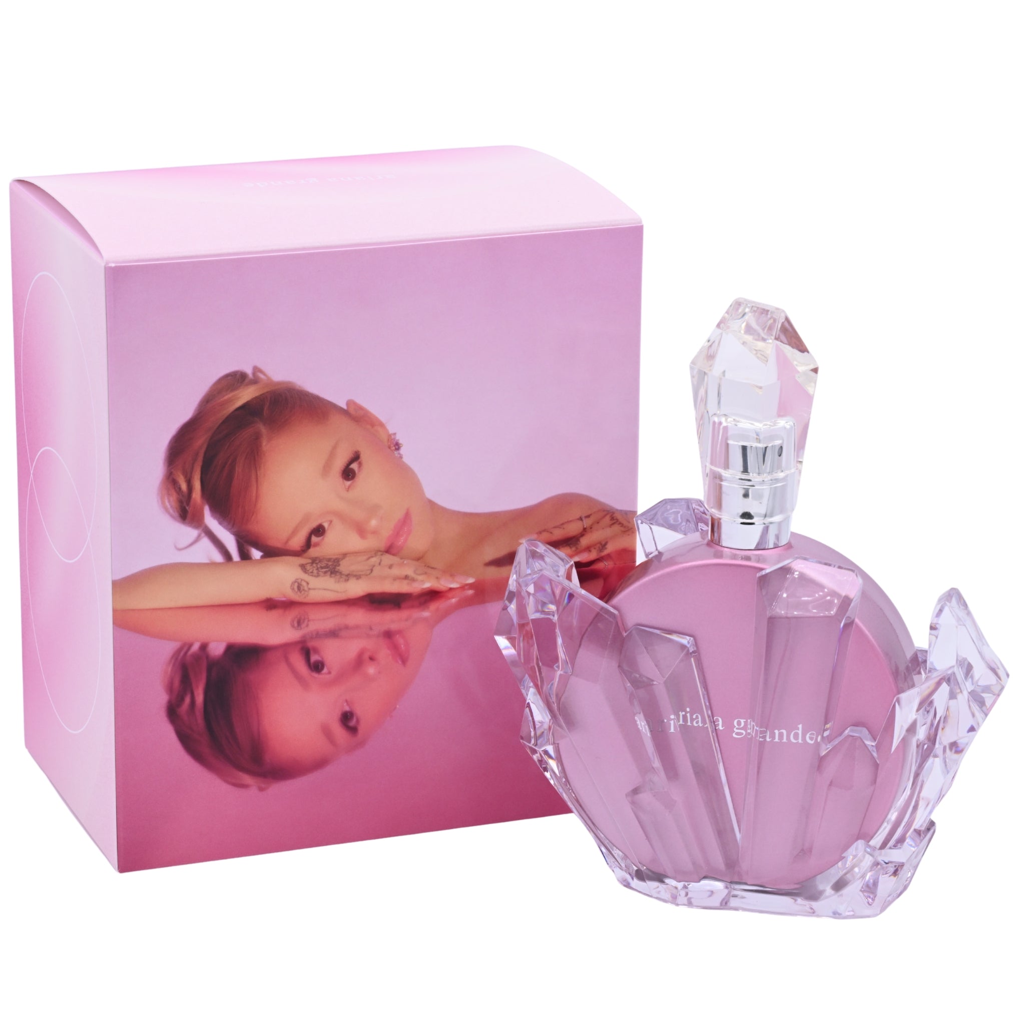 Pink perfume bottle and packaging with a child's face on the box