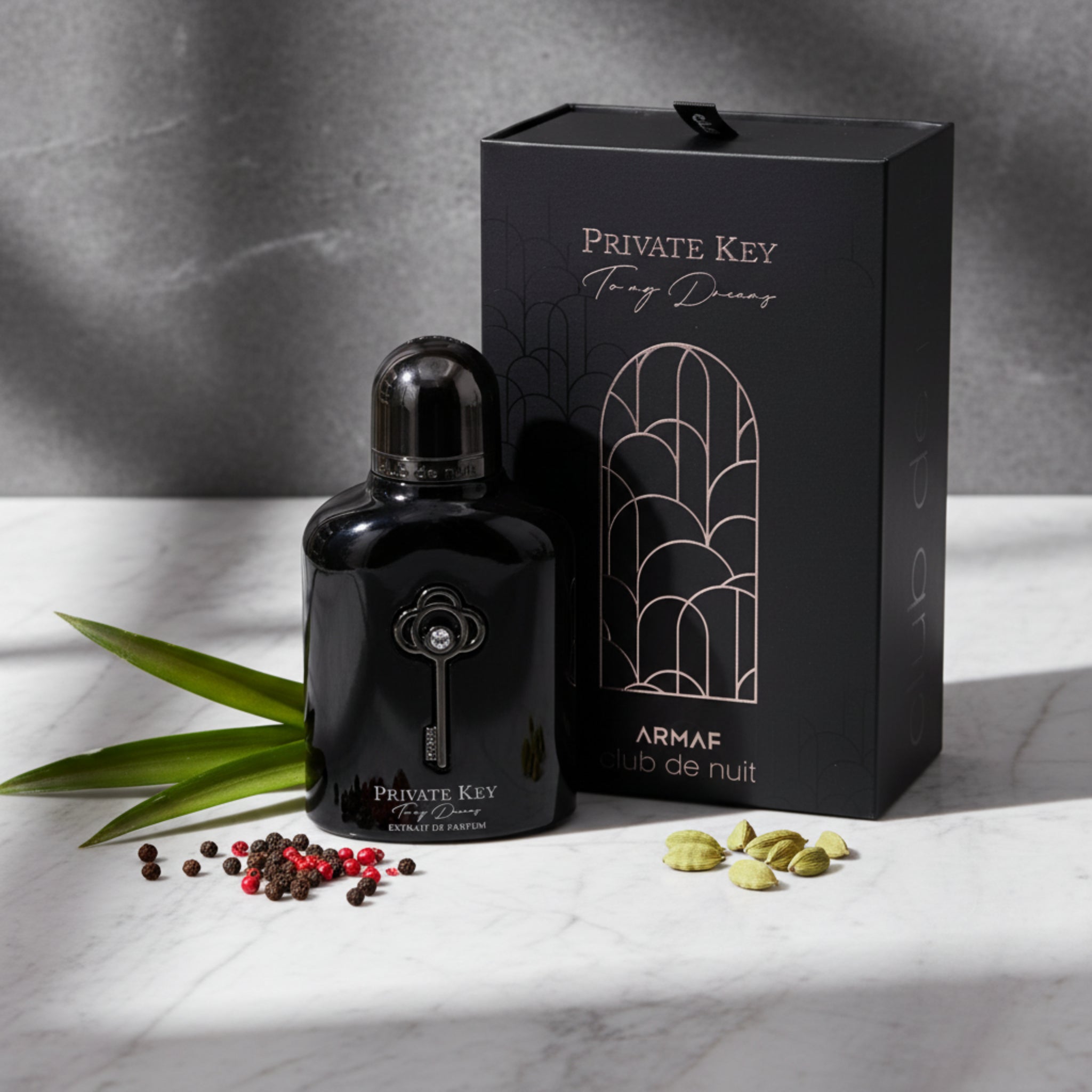 Black perfume bottle and packaging with 'Private Key' branding on a white background