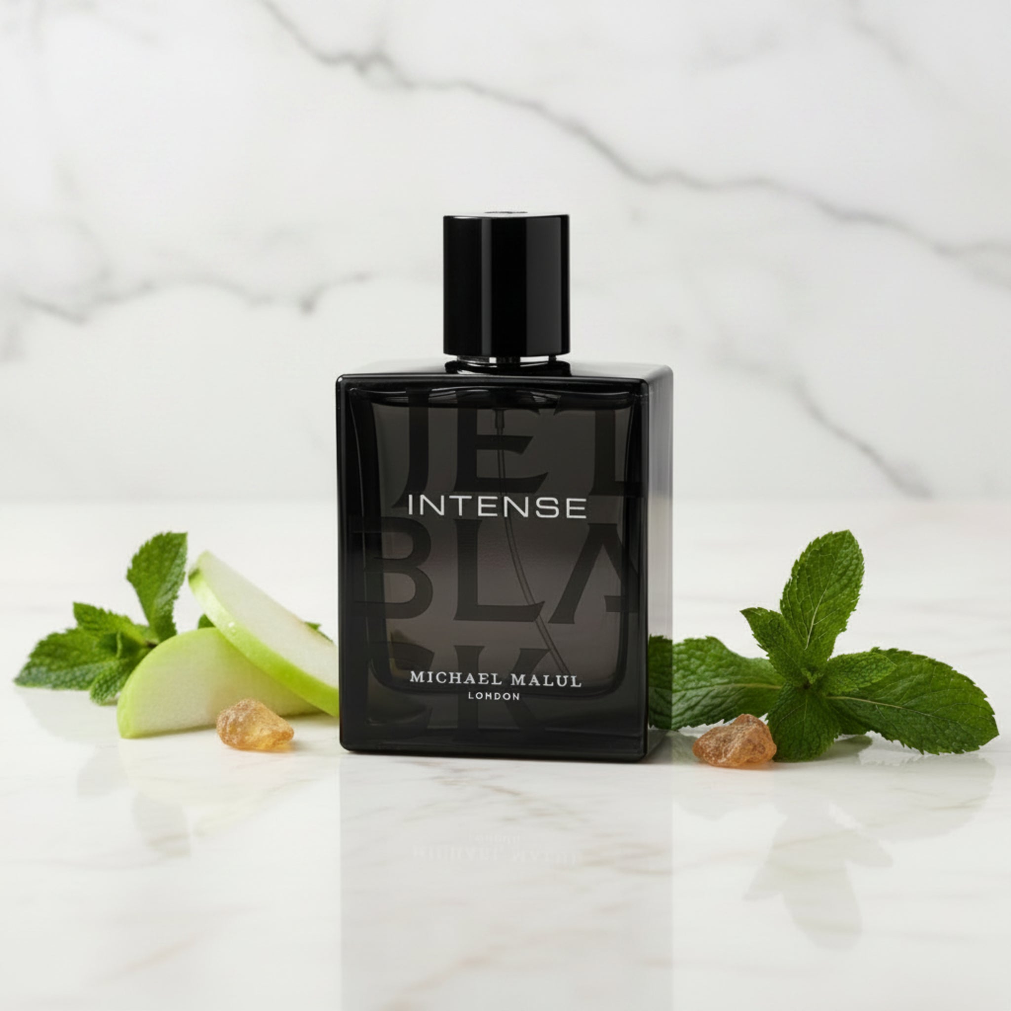 Black perfume bottle labeled 'INTENSE' by Michael Malul on a white background