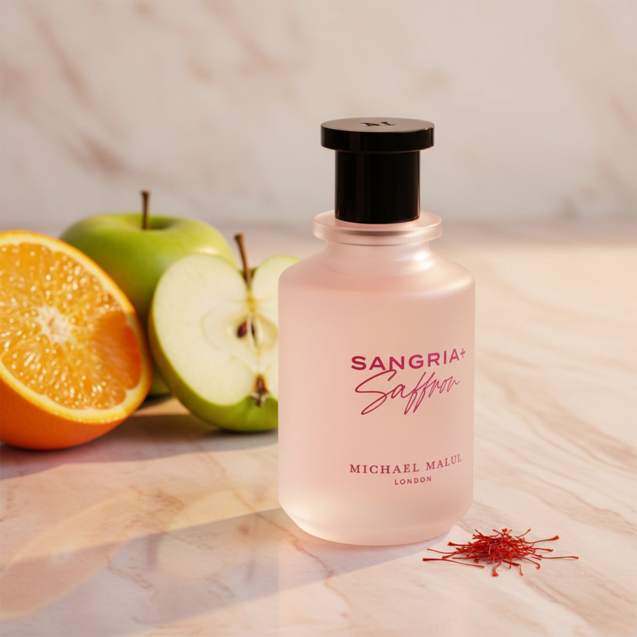 Pink bottle of Michael Malueg Sangria Saffron on a white background