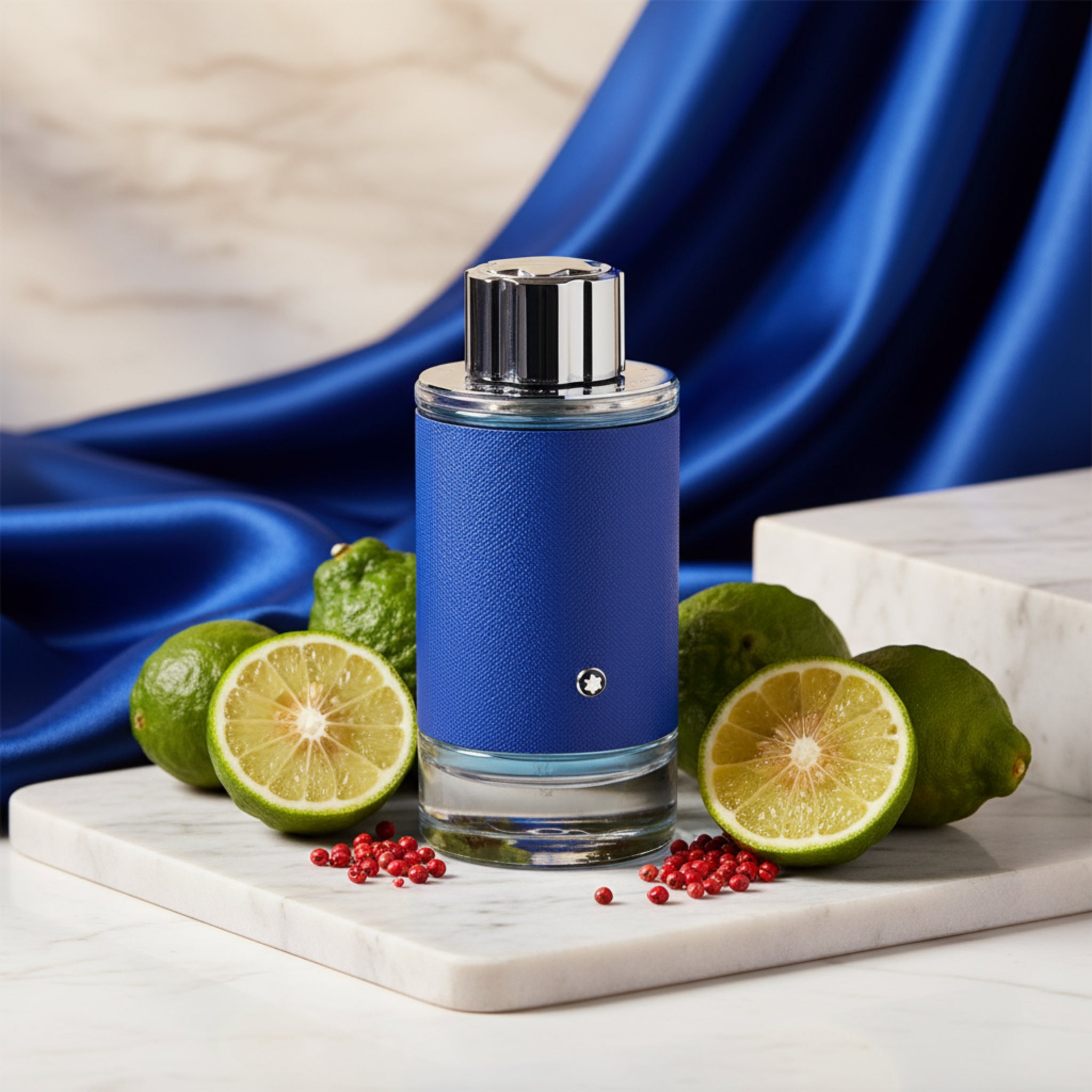 Blue perfume bottle with silver cap on a white background